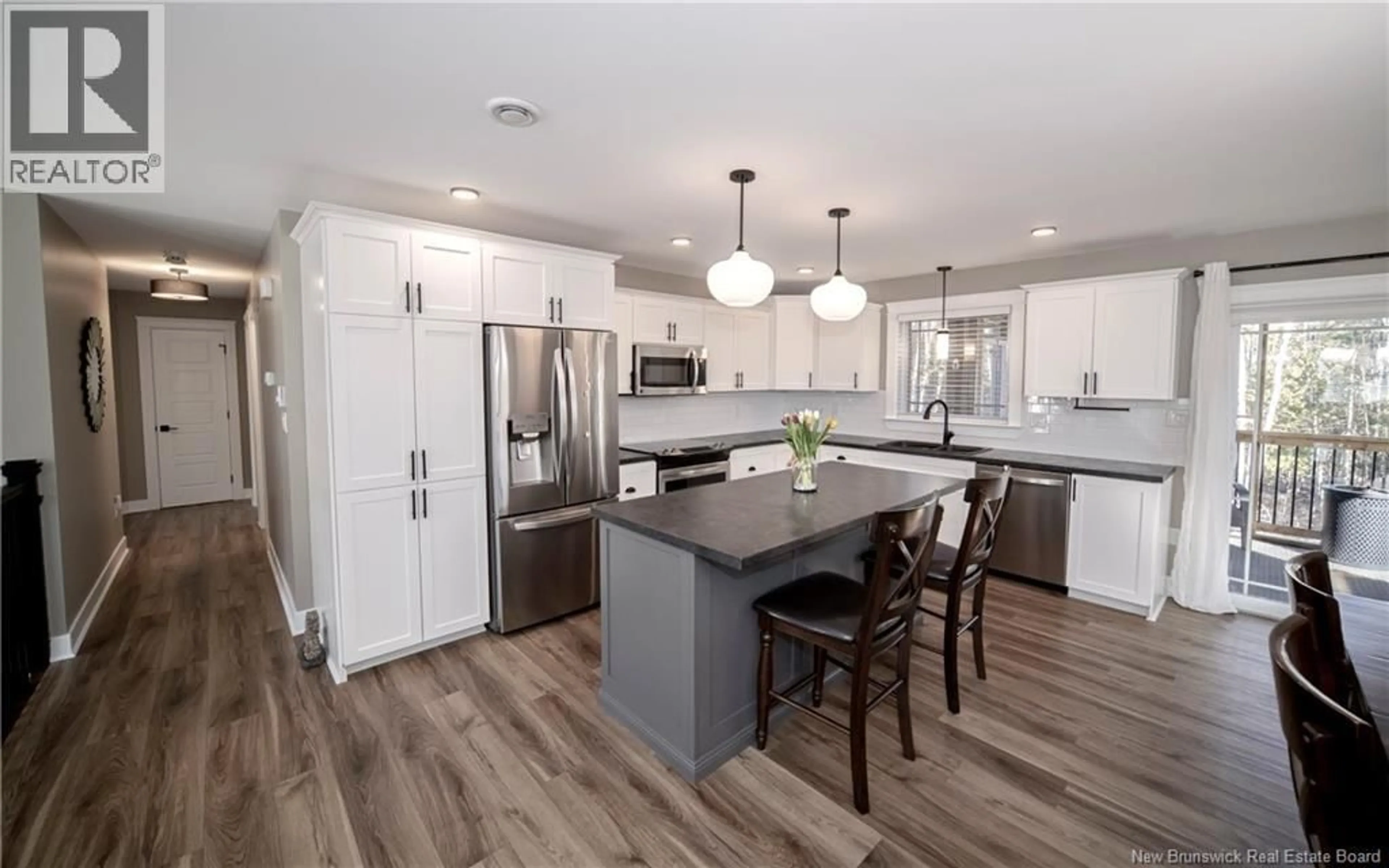 Open concept kitchen, wood/laminate floor for 57 LINDSAY LANE, Burton New Brunswick E2V0J7