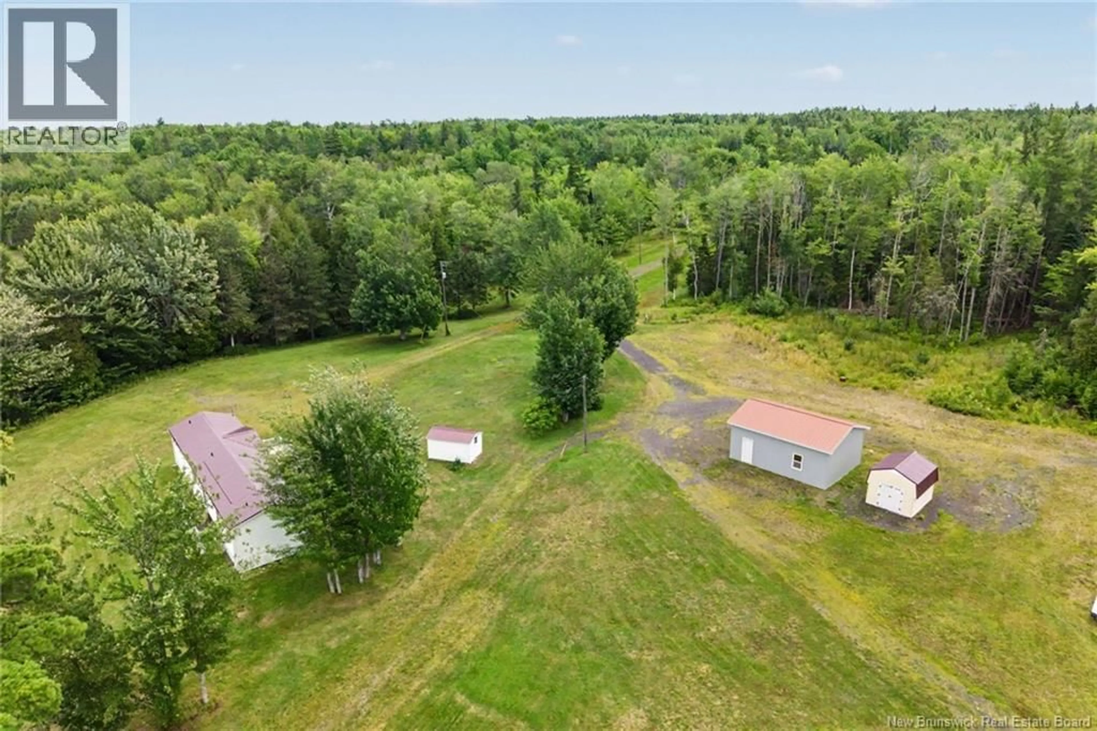 A pic from outside/outdoor area/front of a property/back of a property/a pic from drone, forest/trees view for 388 COX POINT ROAD, Cumberland Bay New Brunswick E4A2X7