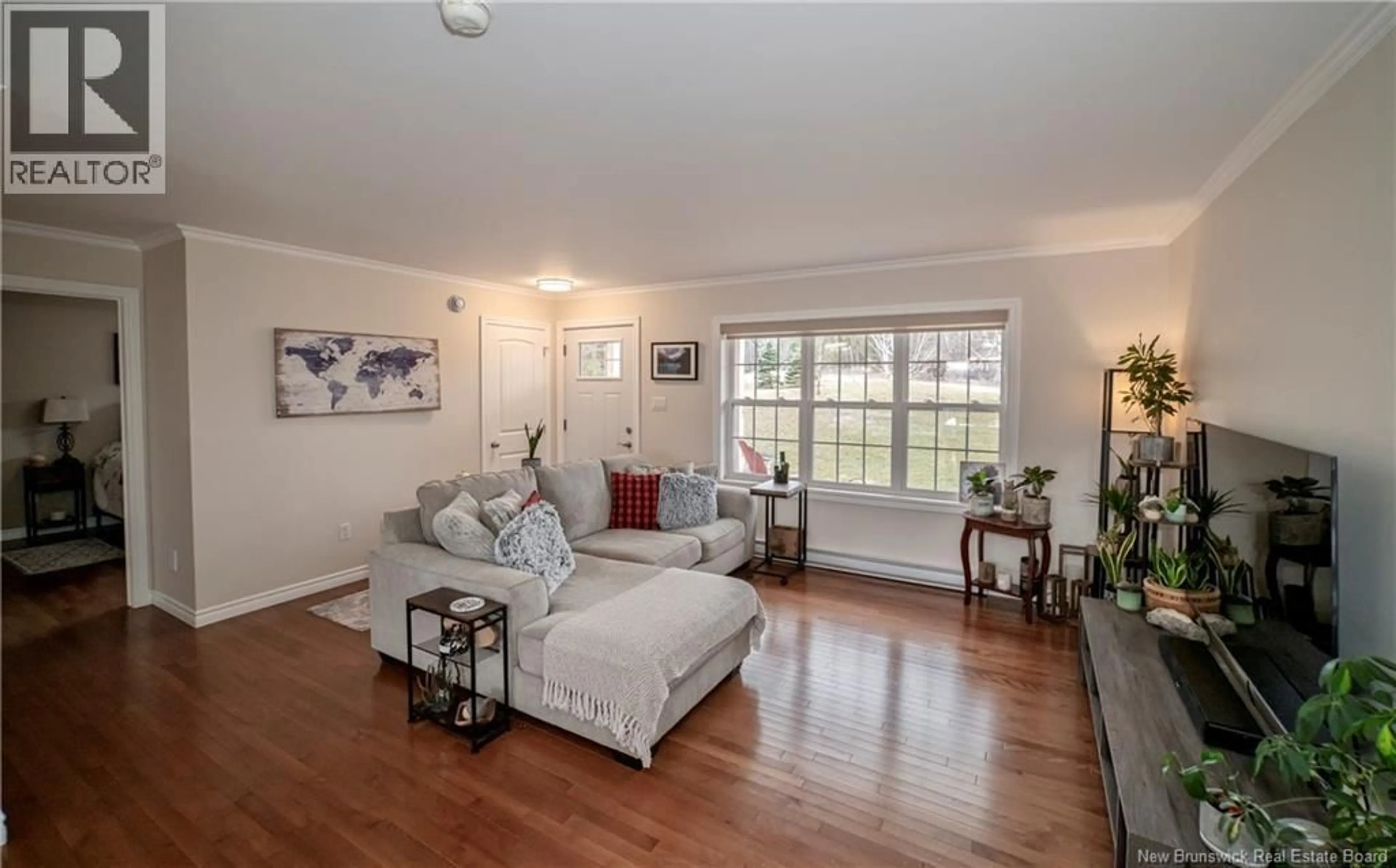 Living room with furniture, wood/laminate floor for 8 LODGE LANE, Prince William New Brunswick E6K3S9