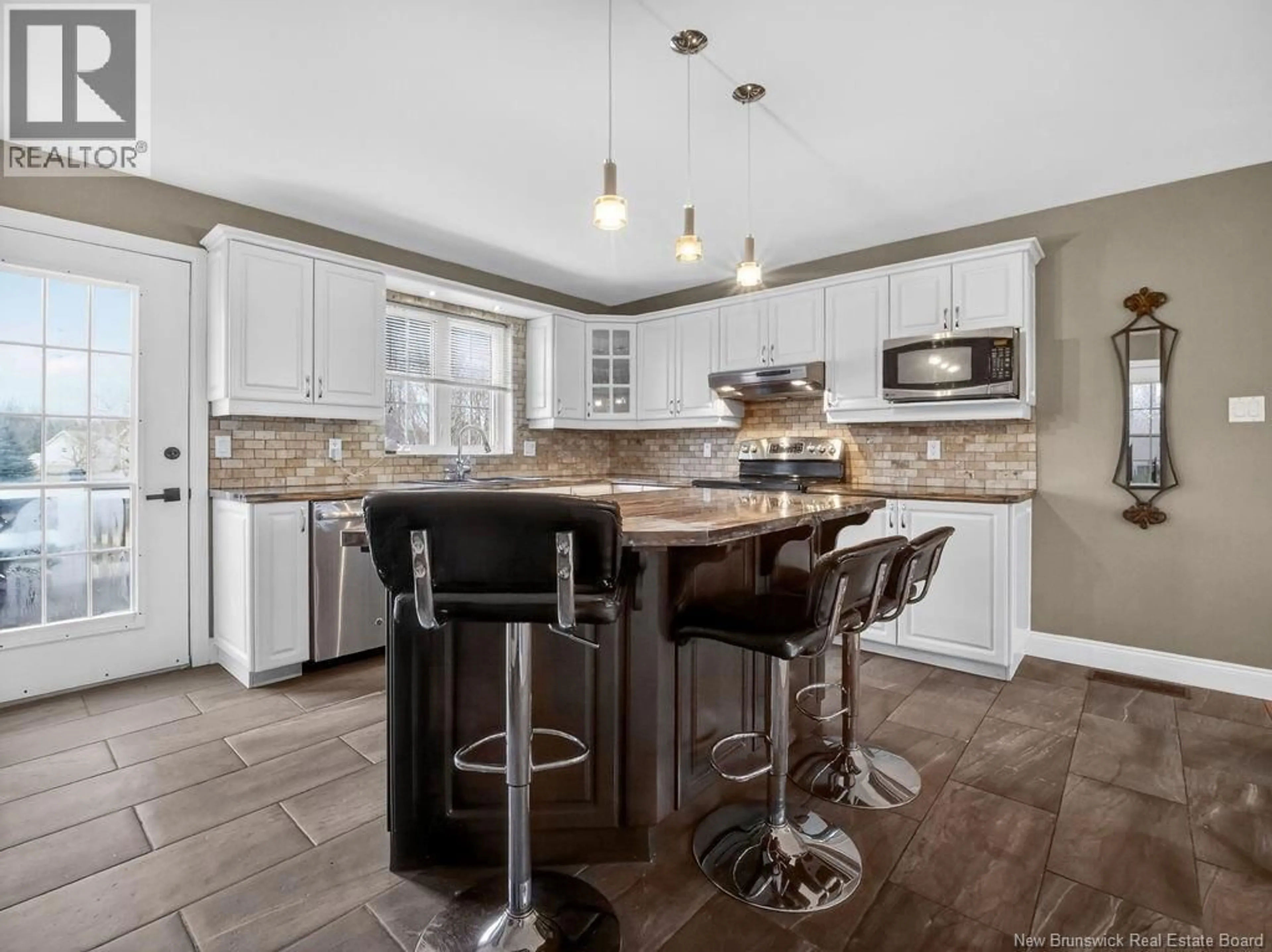 Open concept kitchen, ceramic/tile floor for 91 LEGER STREET, Saint-Antoine New Brunswick E4V1J6