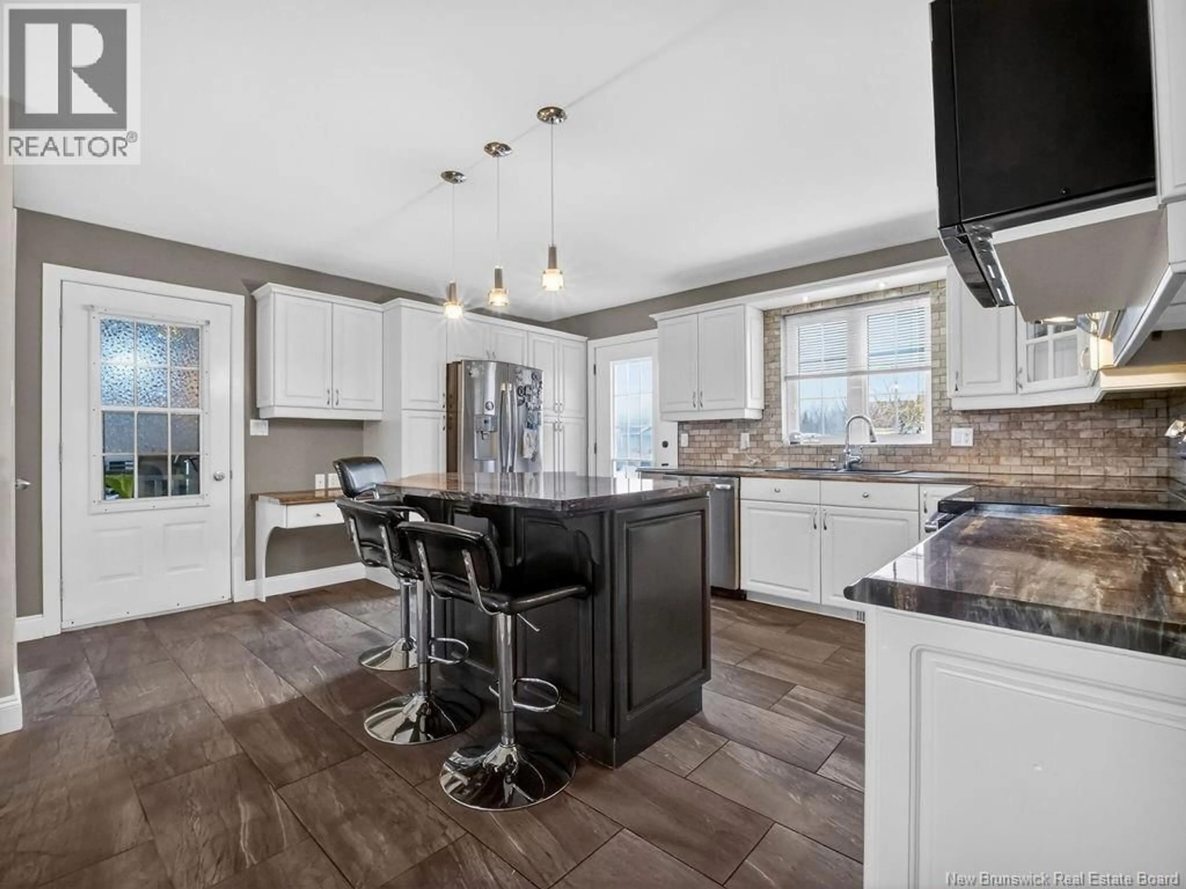Open concept kitchen, ceramic/tile floor for 91 LEGER STREET, Saint-Antoine New Brunswick E4V1J6