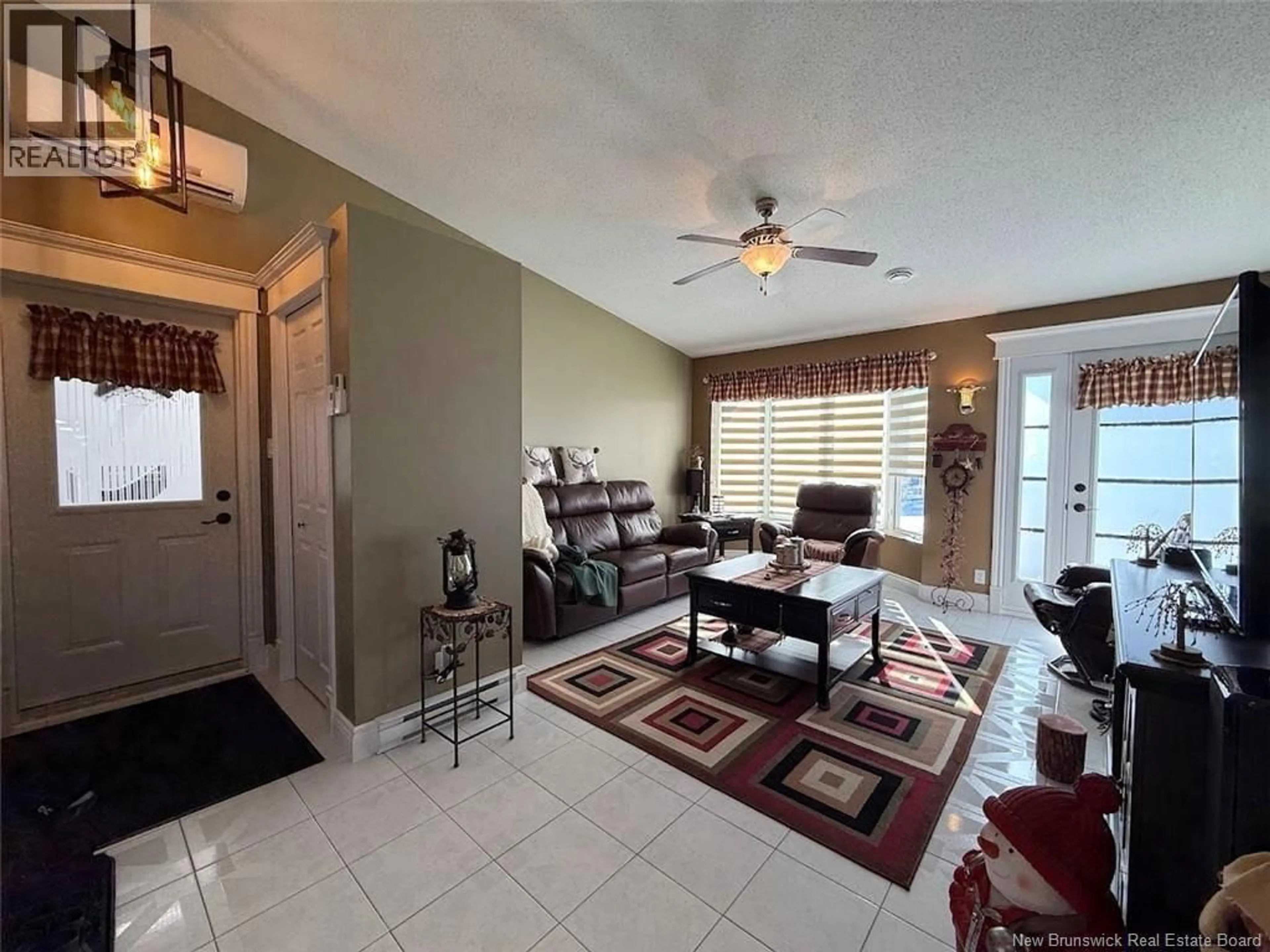 Living room with furniture, ceramic/tile floor for 56 DES GOUVERNEURS STREET, Edmundston New Brunswick E3V4H5