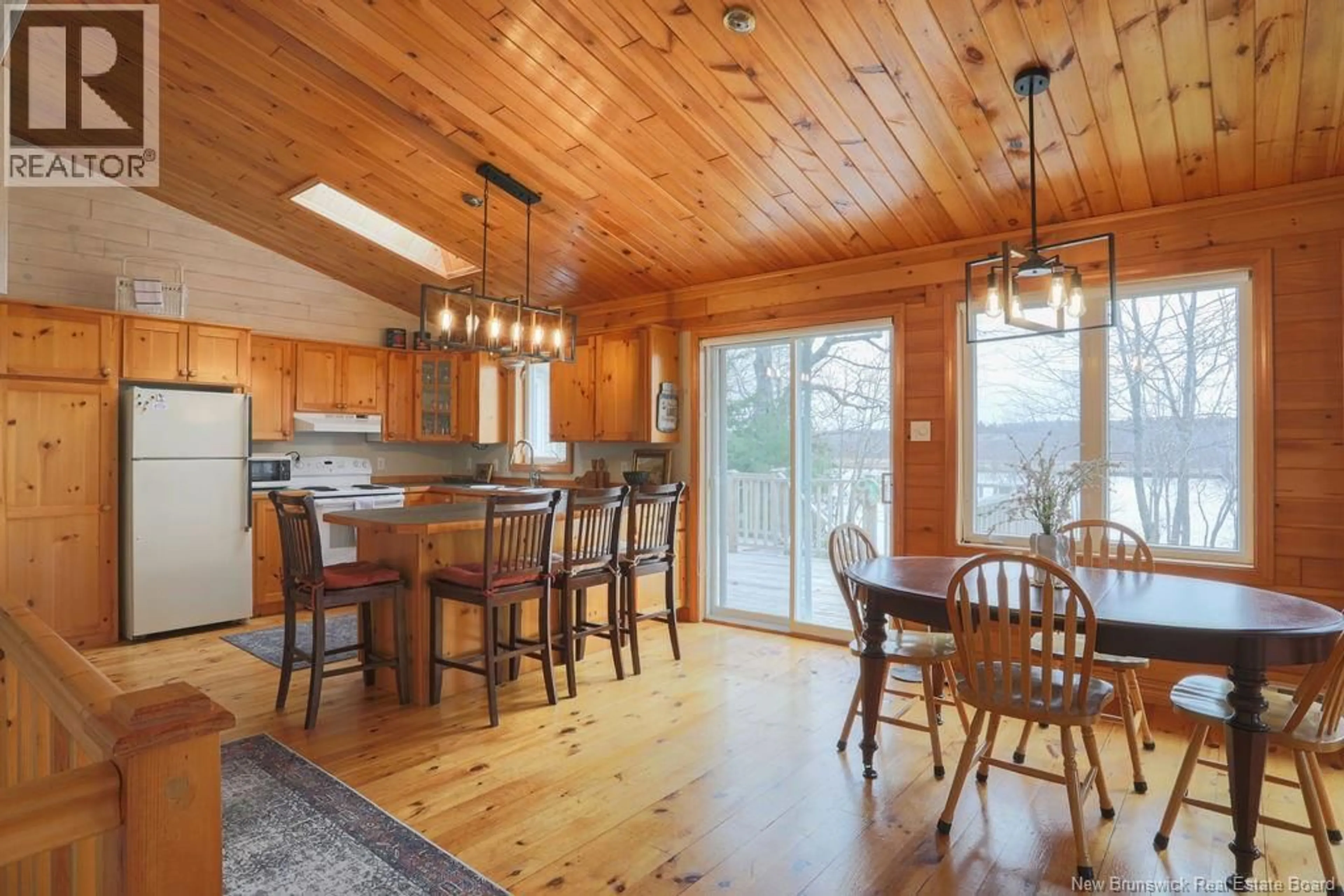 Open concept kitchen, wood/laminate floor for 25 OAK LANE, Coles Island New Brunswick E2C2M4