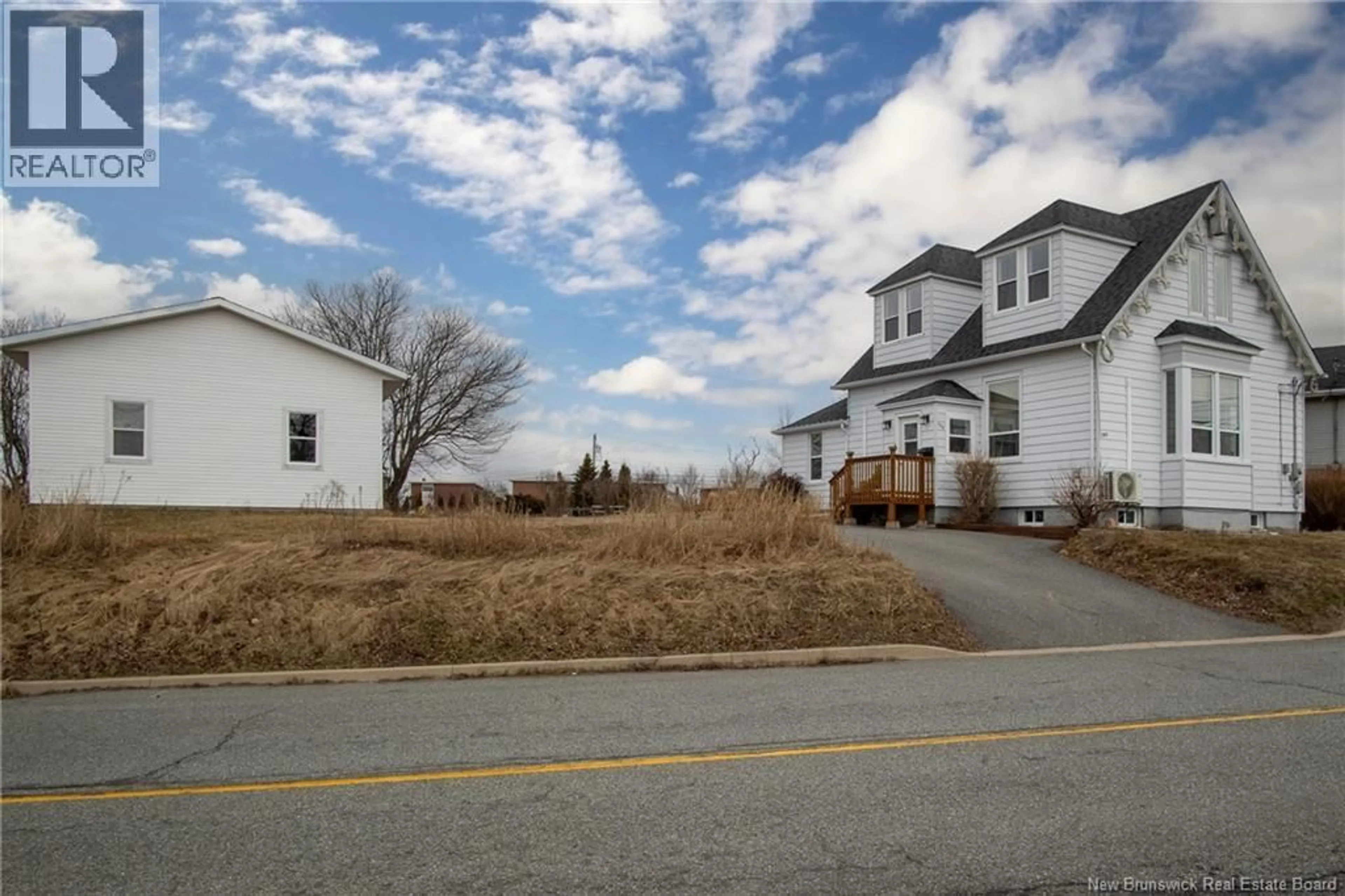 A pic from outside/outdoor area/front of a property/back of a property/a pic from drone, street for 754 SAND COVE ROAD, Saint John New Brunswick E2M3E1
