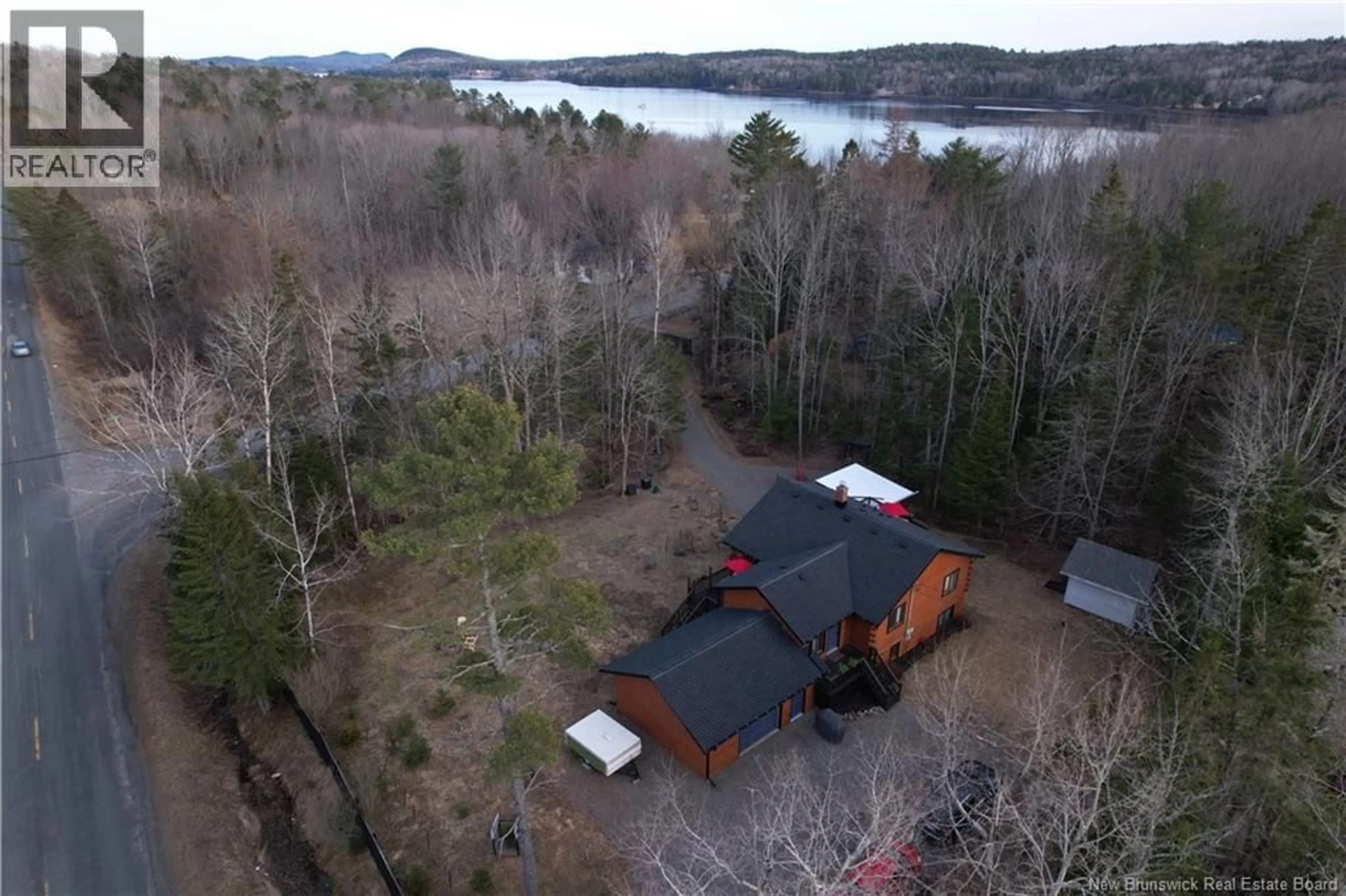 A pic from outside/outdoor area/front of a property/back of a property/a pic from drone, water/lake/river/ocean view for 18 LEDGE LOOP ROAD, Dufferin New Brunswick E3L3P2