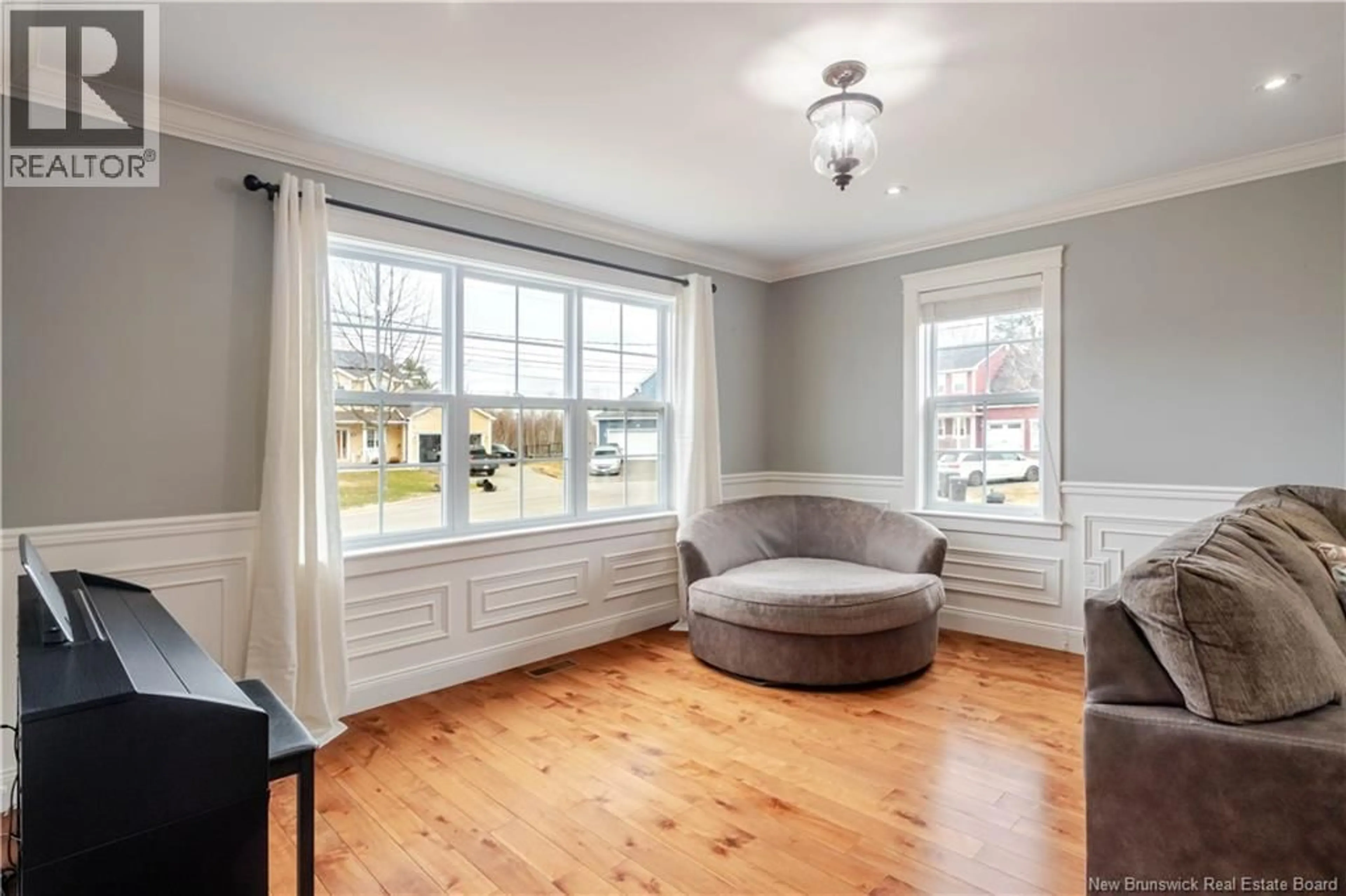 Living room with furniture, wood/laminate floor for 34 MAVIS COURT, Fredericton New Brunswick E3B0E9