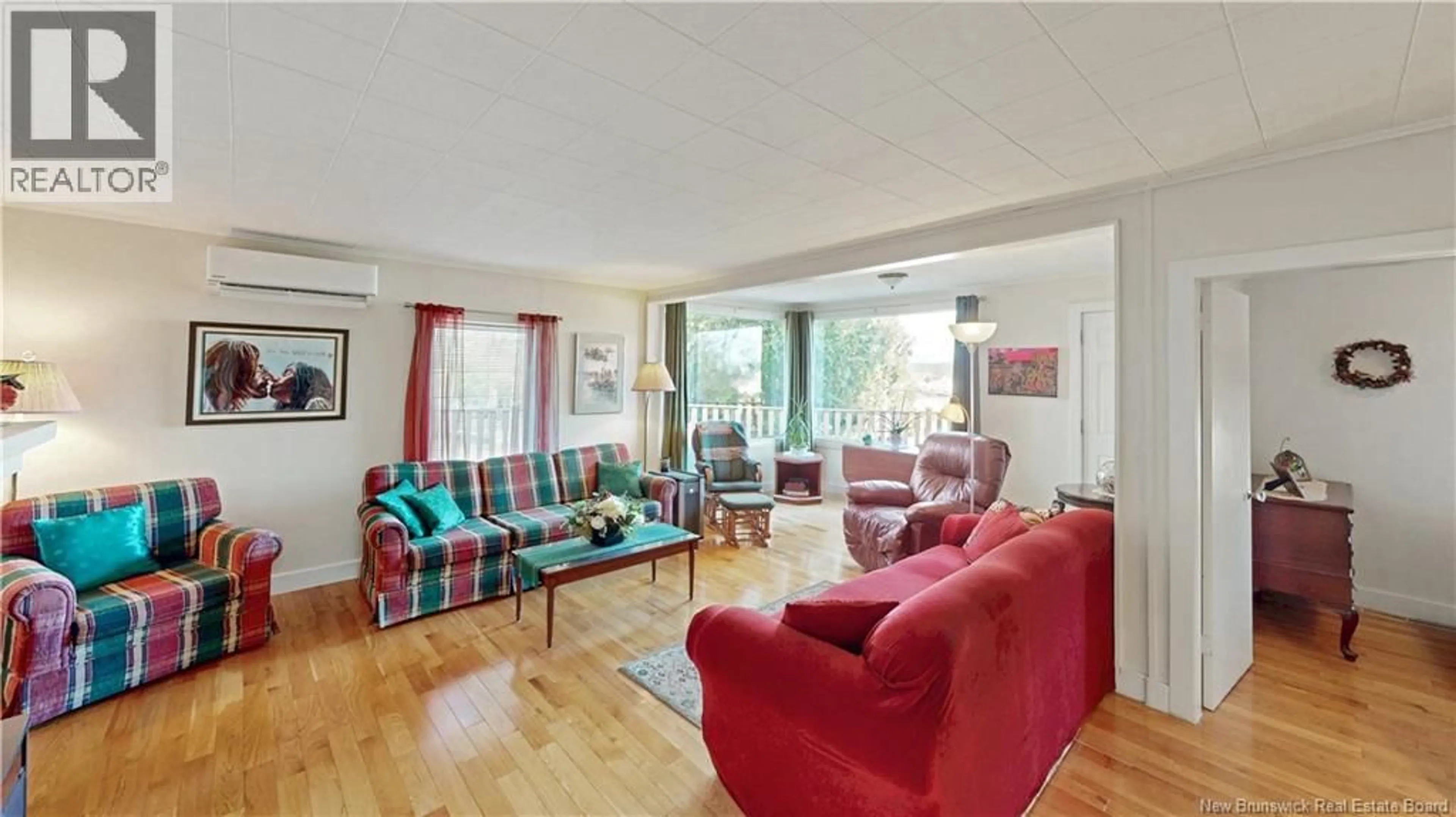 Living room with furniture, wood/laminate floor for 102 MANNERS SUTTON ROAD, Saint John New Brunswick E2K2E1