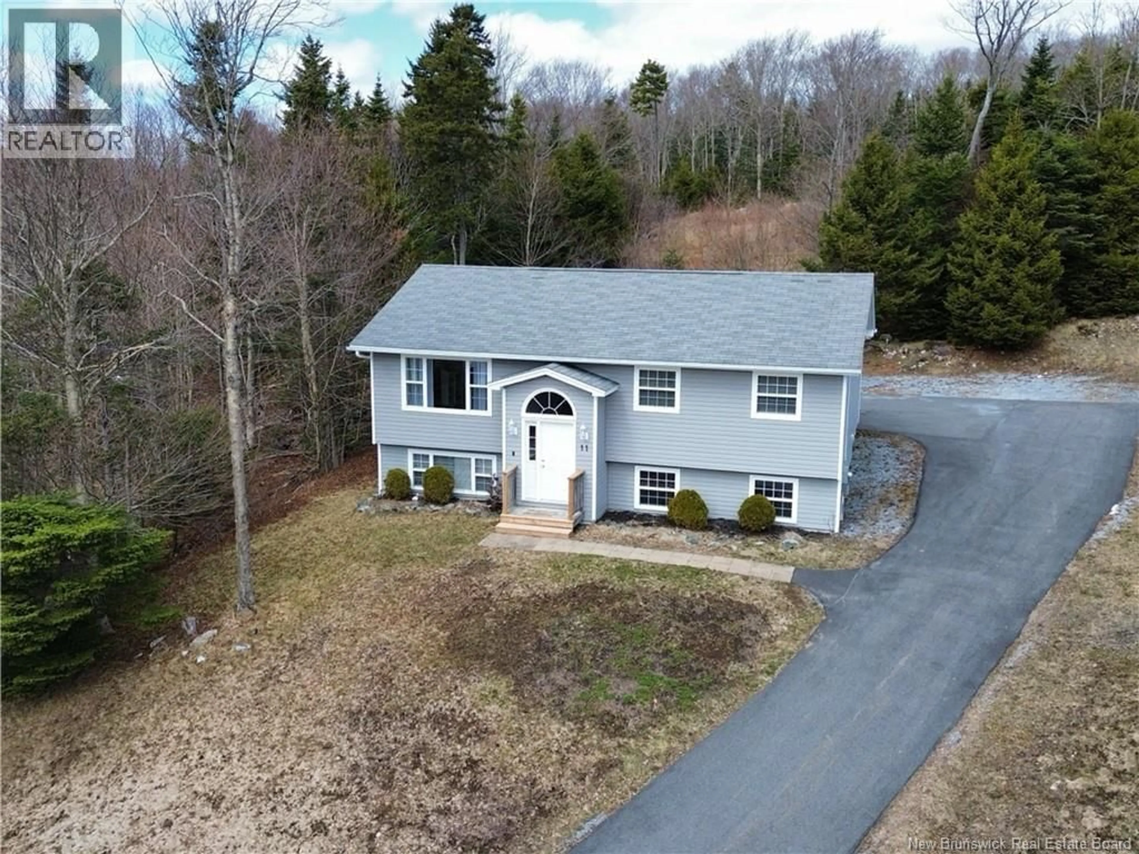 A pic from outside/outdoor area/front of a property/back of a property/a pic from drone, street for 11 DOLLY DRIVE, Saint John New Brunswick E2J0C9