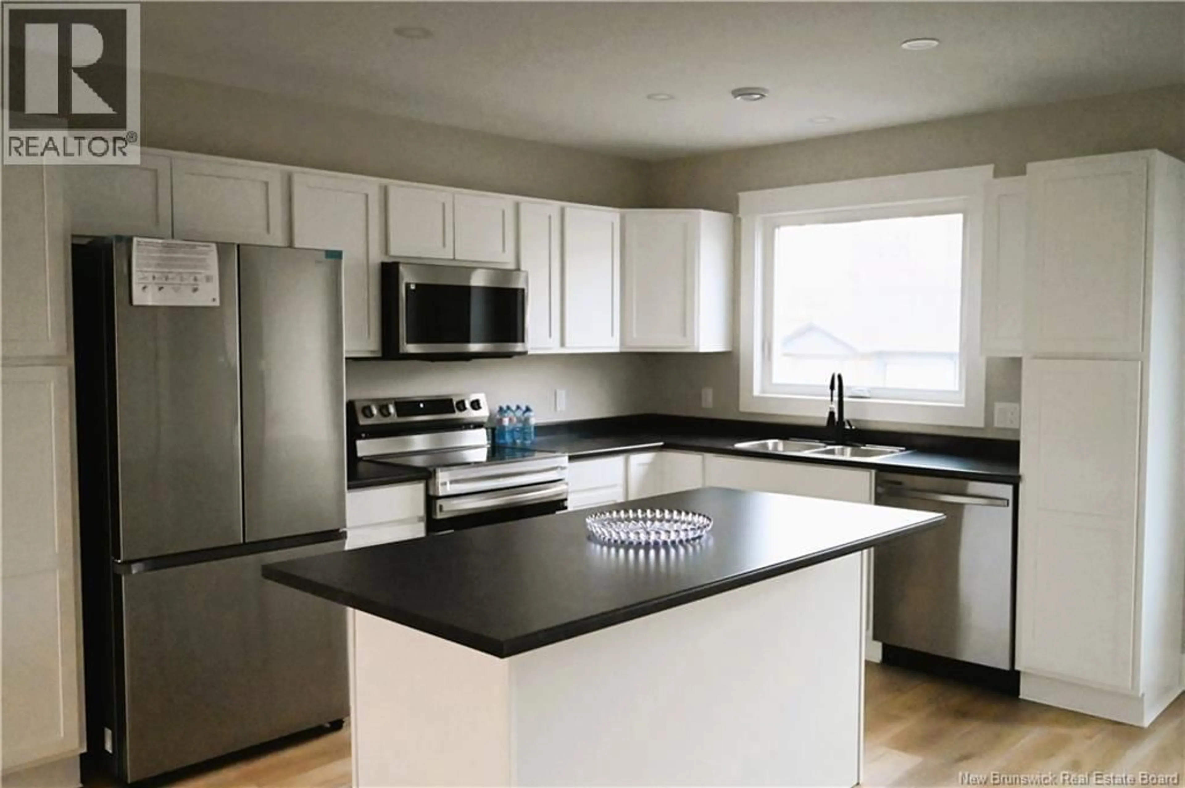 Open concept kitchen, wood/laminate floor for 171 ARLINGTON CRESCENT, Saint John New Brunswick E2K0G4