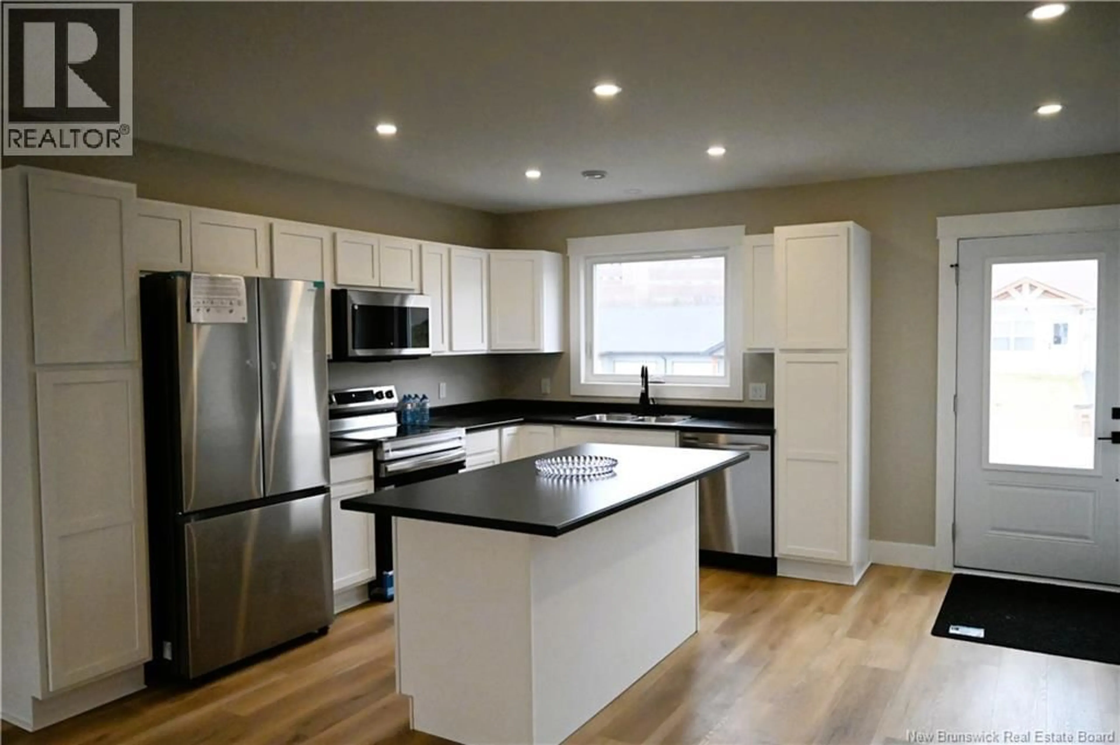 Open concept kitchen, wood/laminate floor for 171 ARLINGTON CRESCENT, Saint John New Brunswick E2K0G4