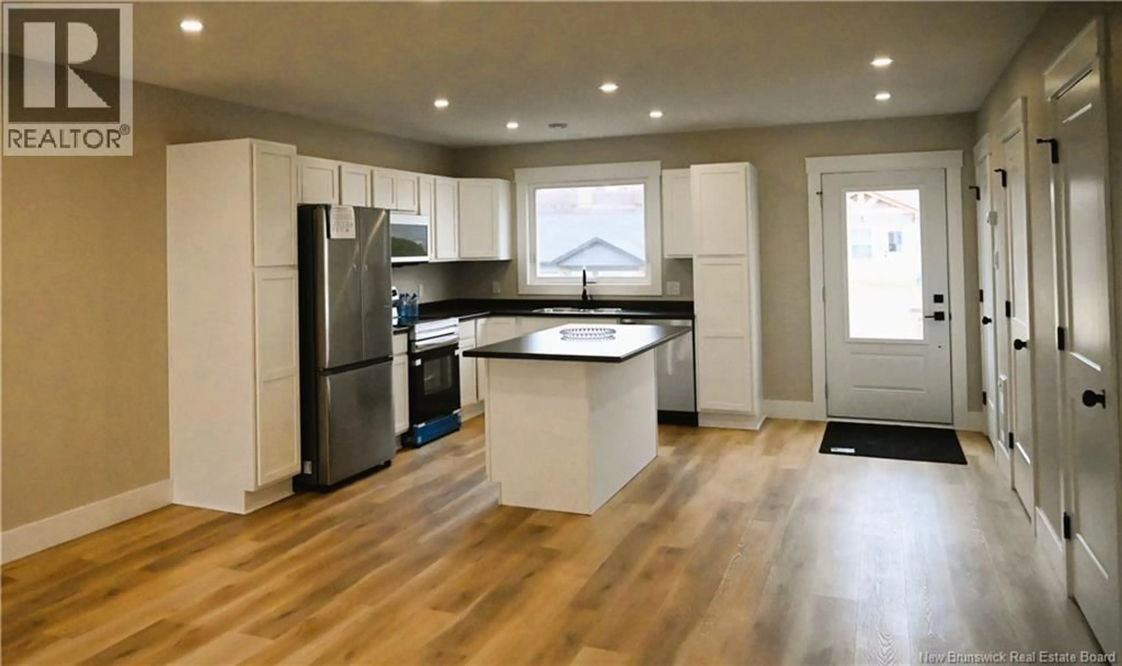 Open concept kitchen, wood/laminate floor for 171 ARLINGTON CRESCENT, Saint John New Brunswick E2K0G4