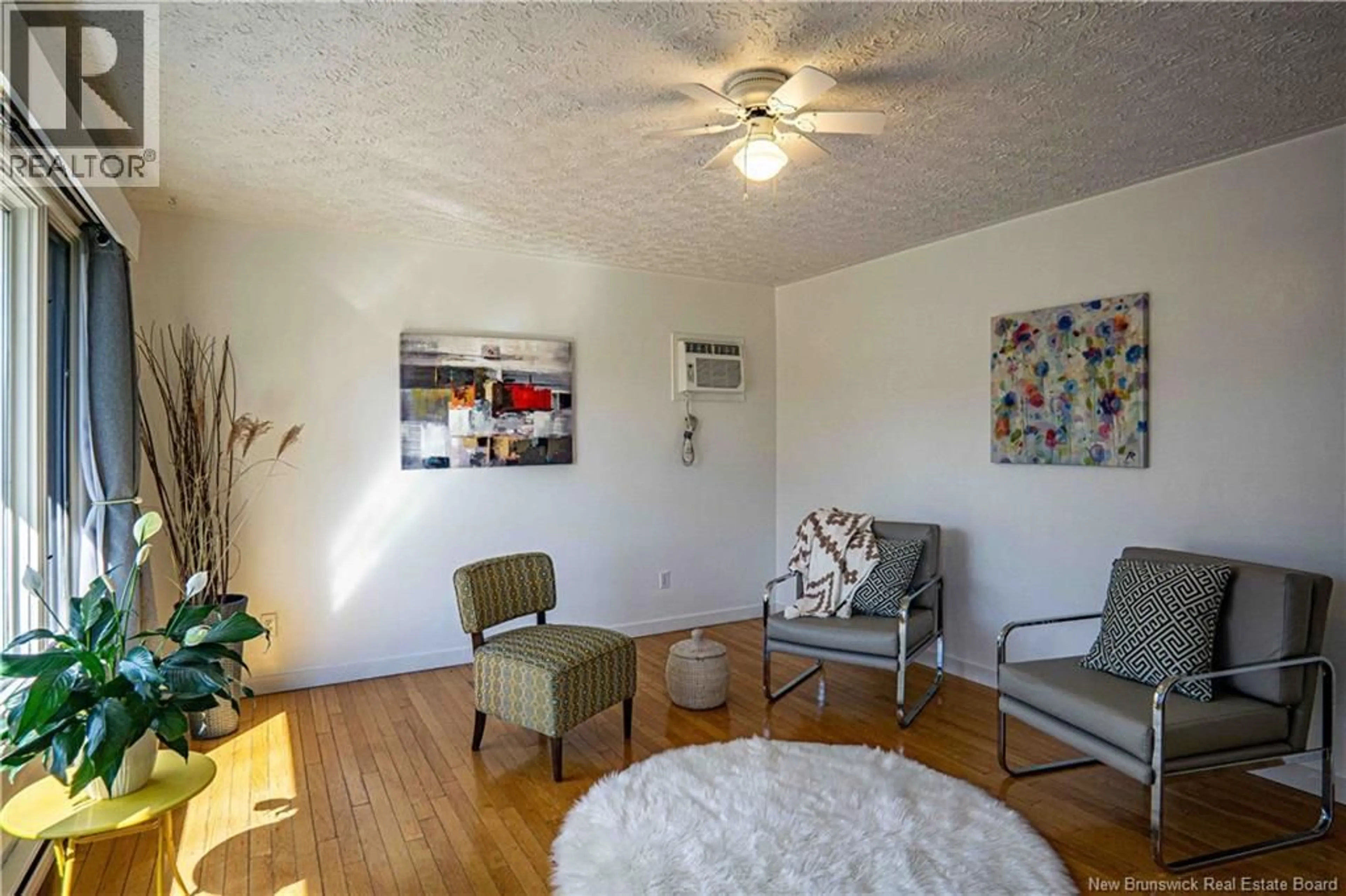 Living room with furniture, wood/laminate floor for 19 COVENTRY CRESCENT, Fredericton New Brunswick E3B4P4