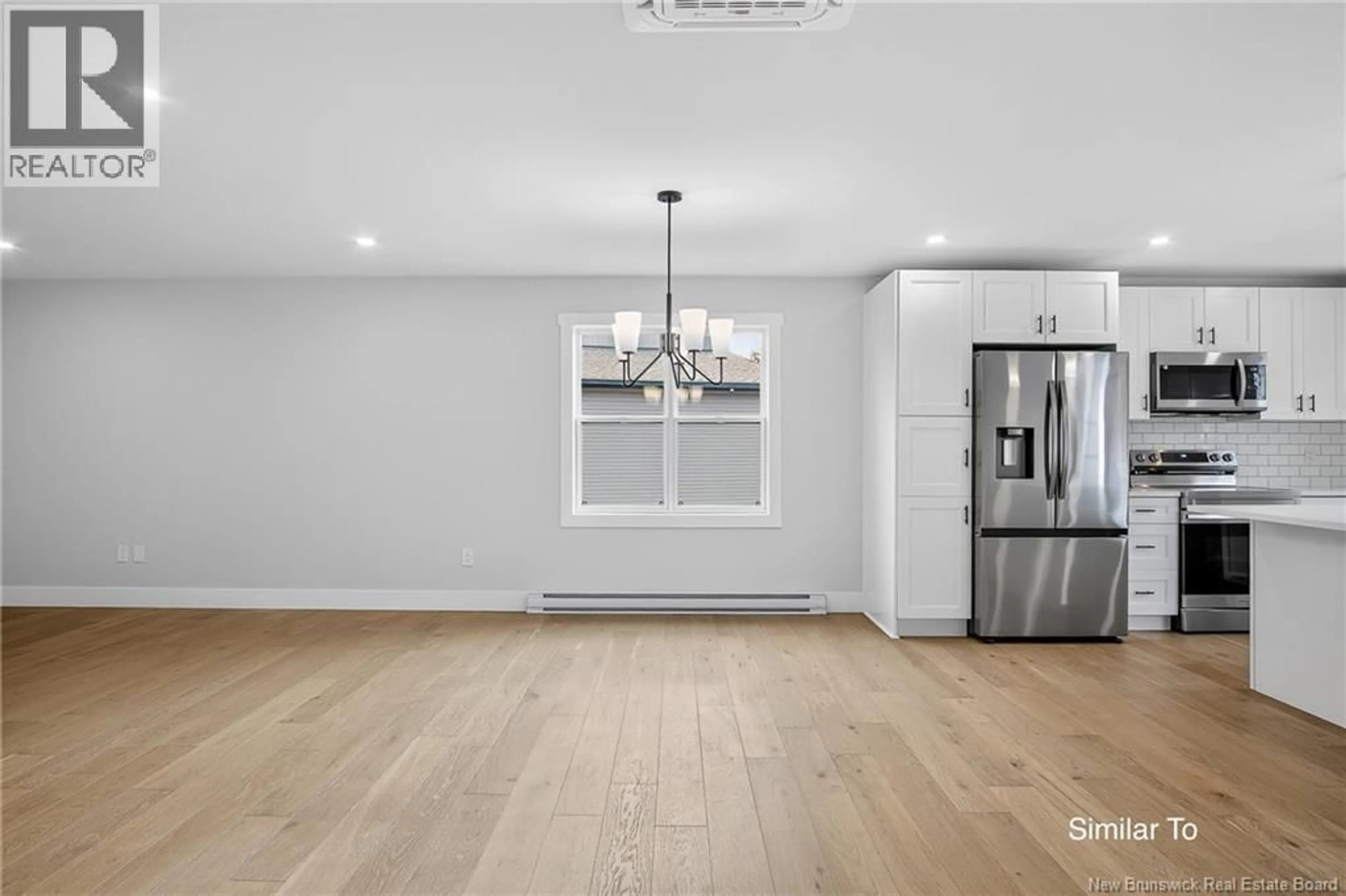 Open concept kitchen, wood/laminate floor for 8 BELLBOTTOM WAY, Quispamsis New Brunswick E2G1Y9