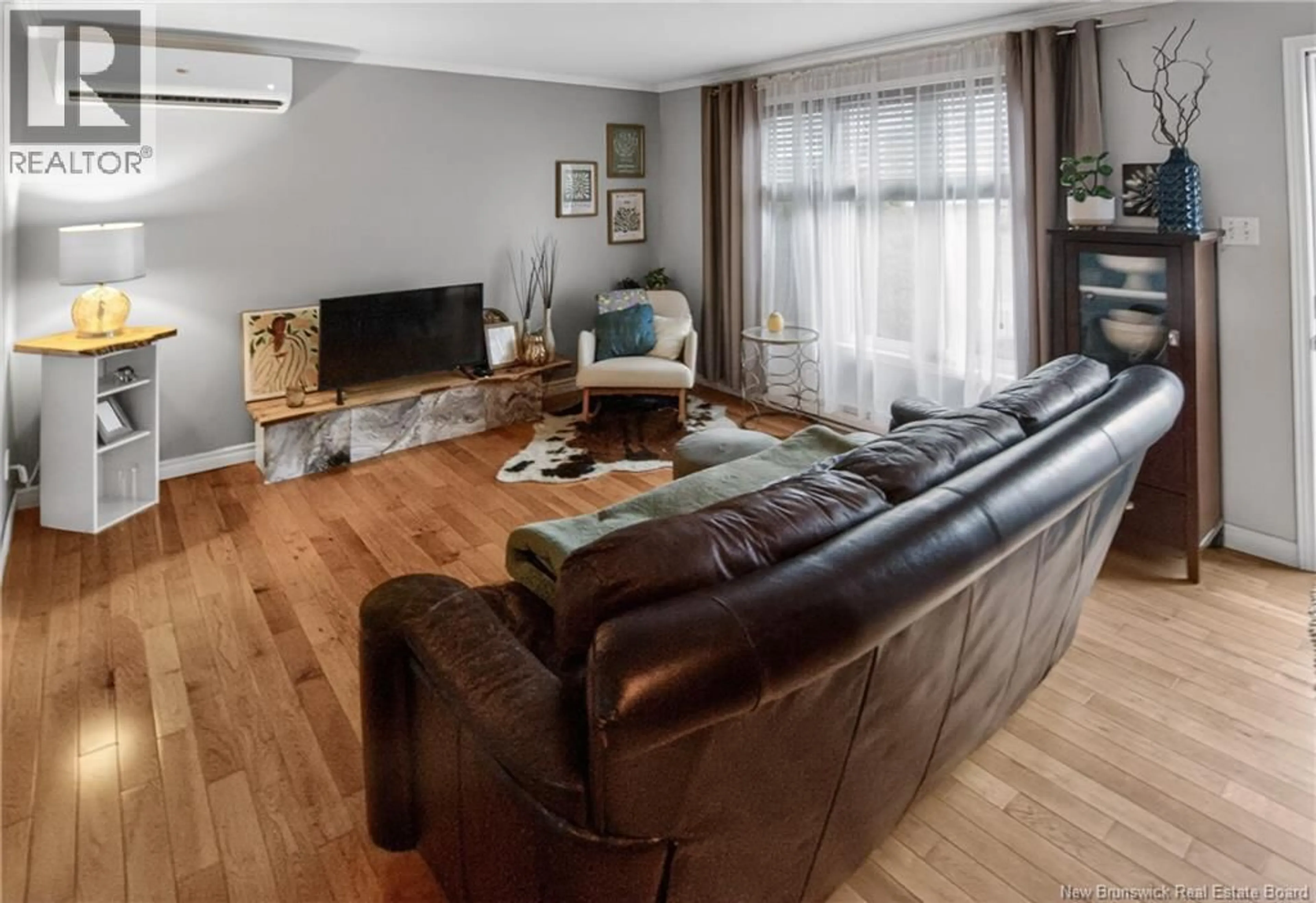 Living room with furniture, wood/laminate floor for 41 ROCKMAPLE DRIVE, Moncton New Brunswick E1G2H1