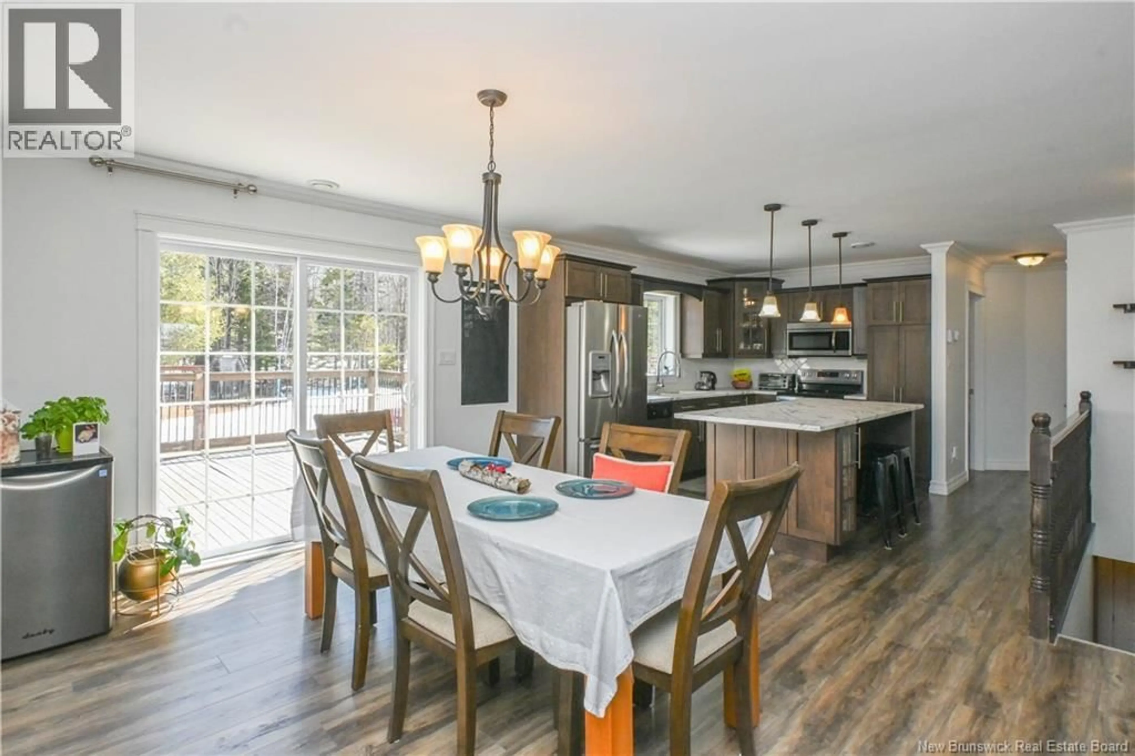Open concept kitchen, wood/laminate floor for 37 BOIS-HÉBERT ROAD, Saint-Isidore New Brunswick E8M0A3