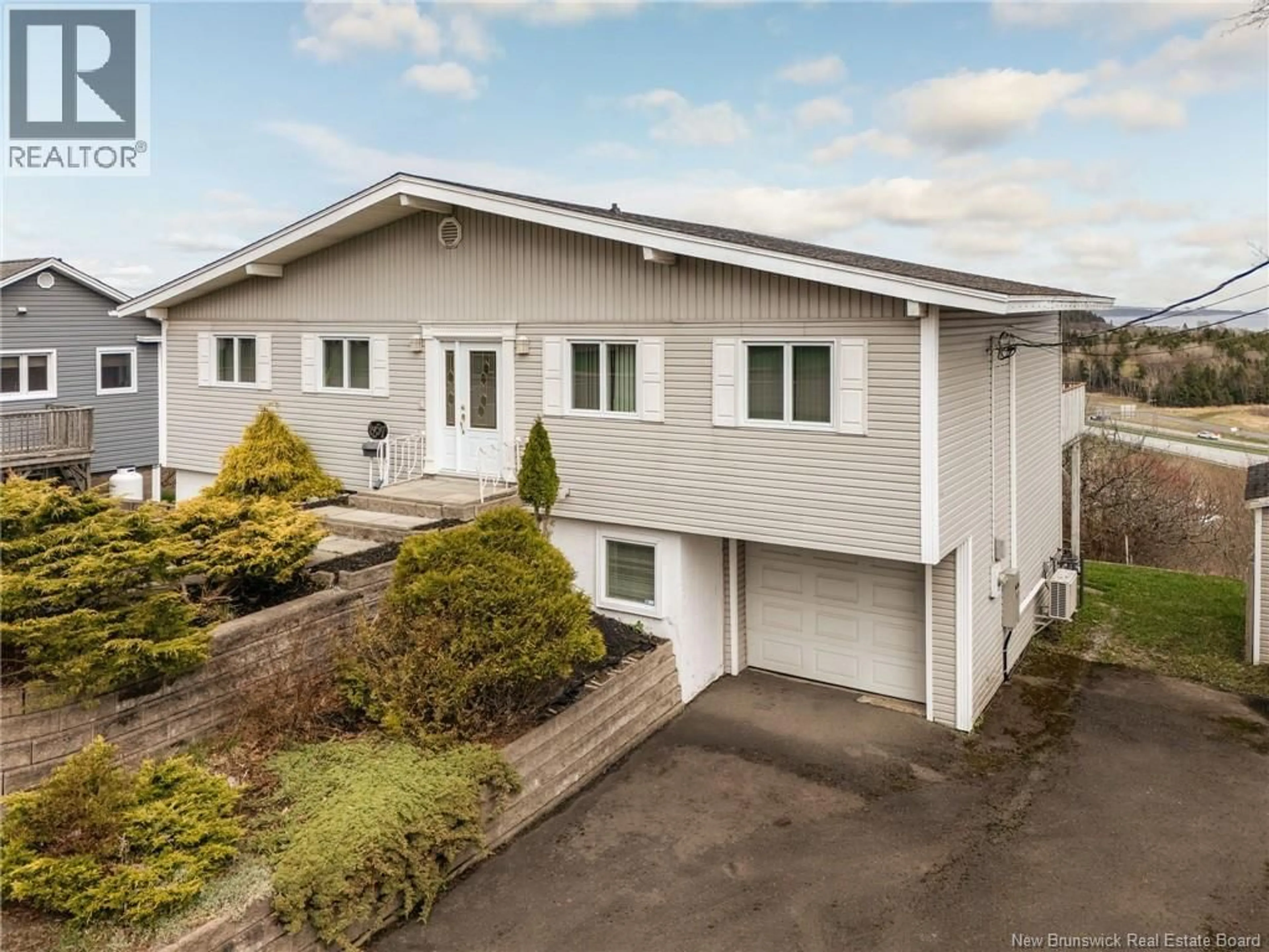 A pic from outside/outdoor area/front of a property/back of a property/a pic from drone, street for 1257 MANAWAGONISH ROAD, Saint John New Brunswick E2M3X8