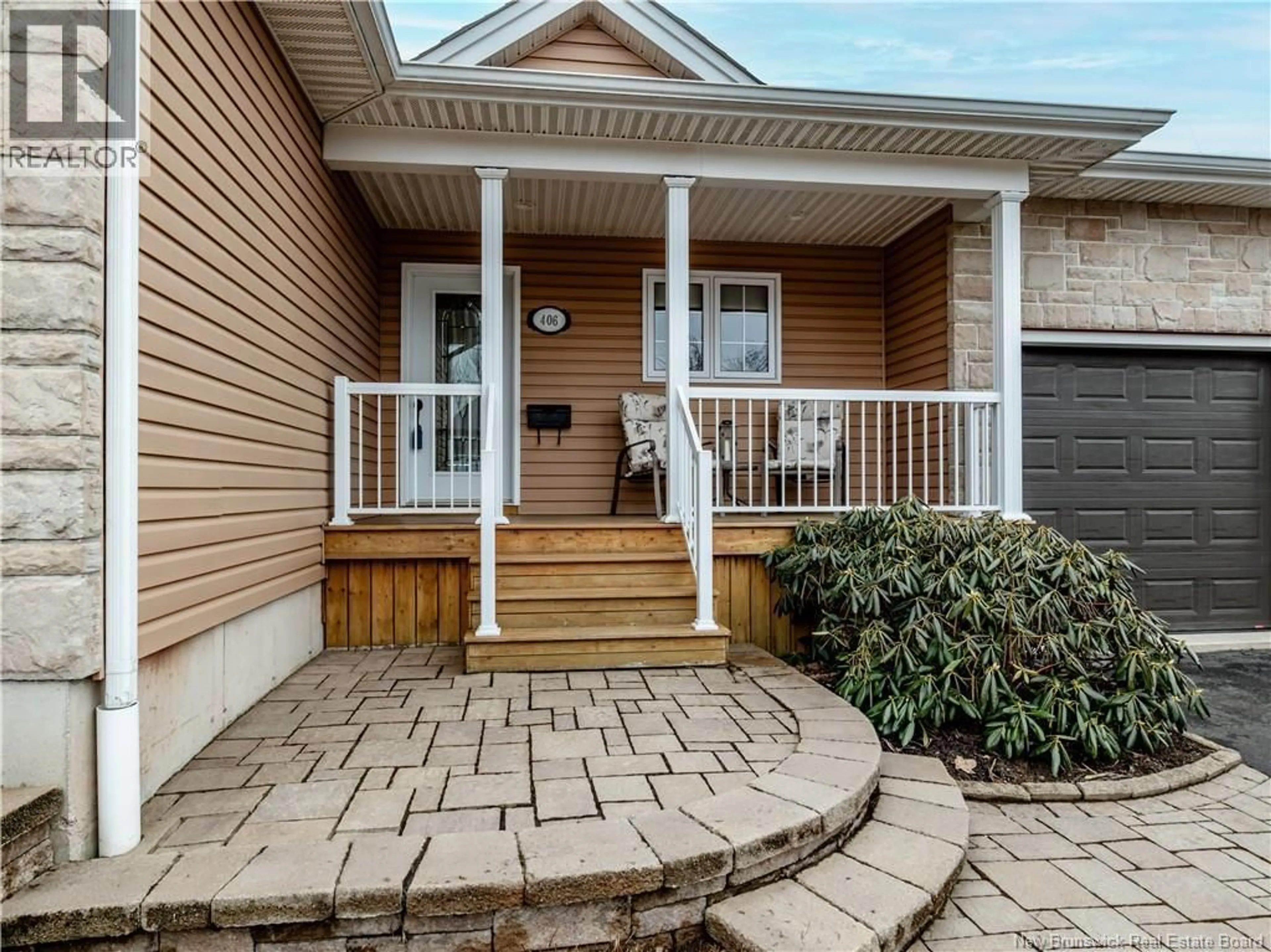 Home with vinyl exterior material, street for 406 BELLIVEAU, Dieppe New Brunswick E1A6W6