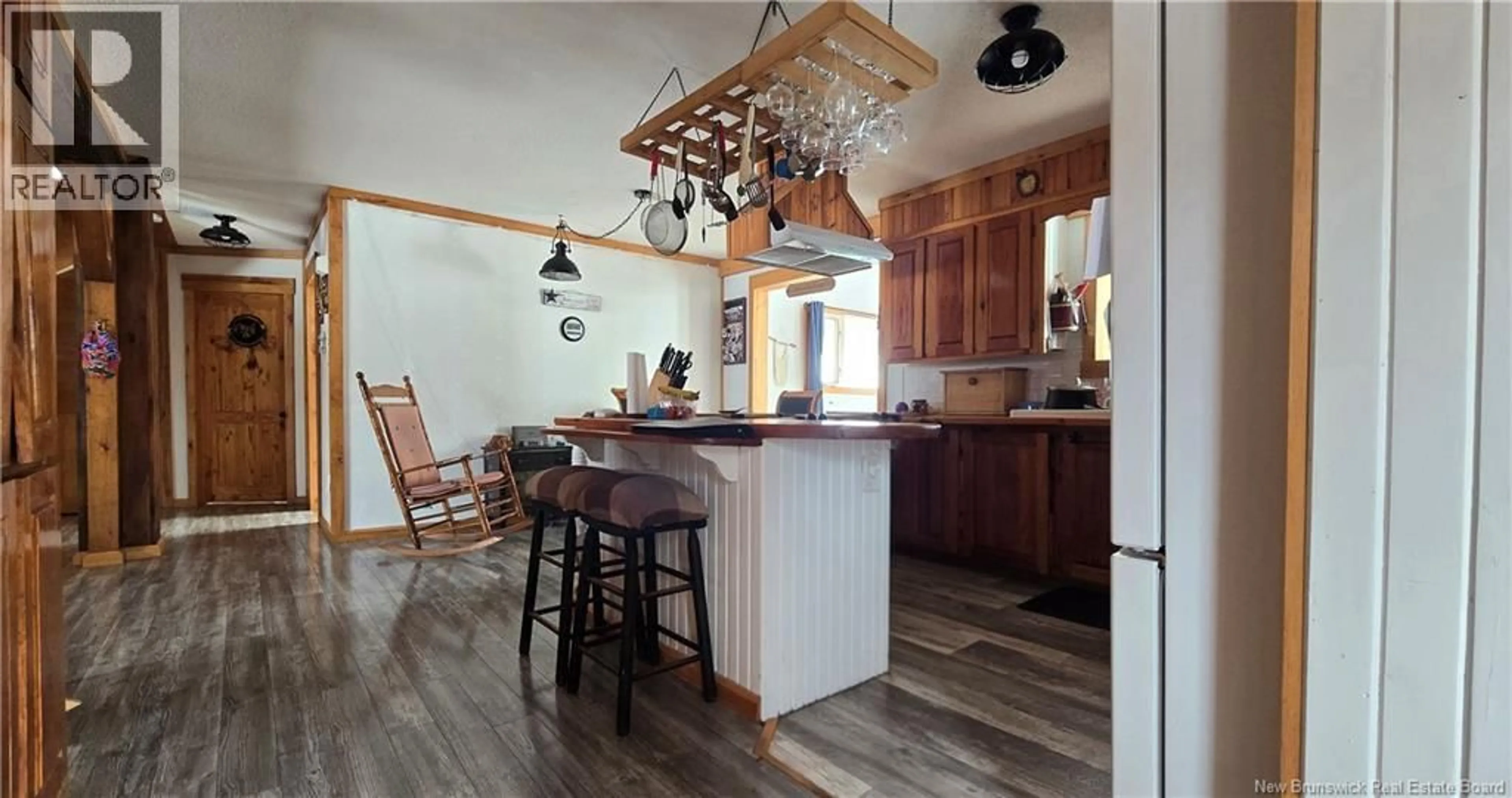 Open concept kitchen, wood/laminate floor for 82 BELANGER ROAD, Saint-Arthur New Brunswick E3N5P1