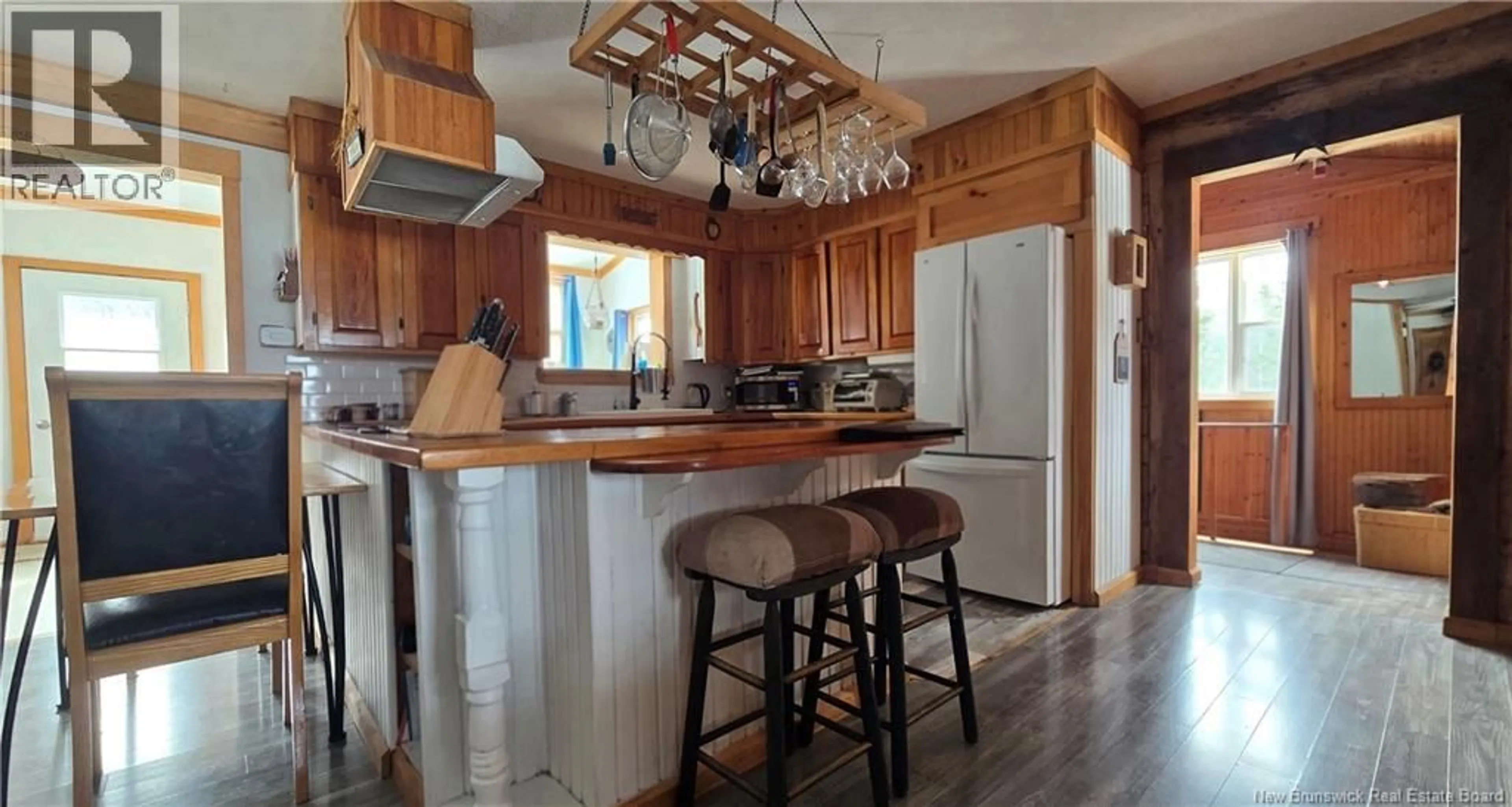 Open concept kitchen, wood/laminate floor for 82 BELANGER ROAD, Saint-Arthur New Brunswick E3N5P1
