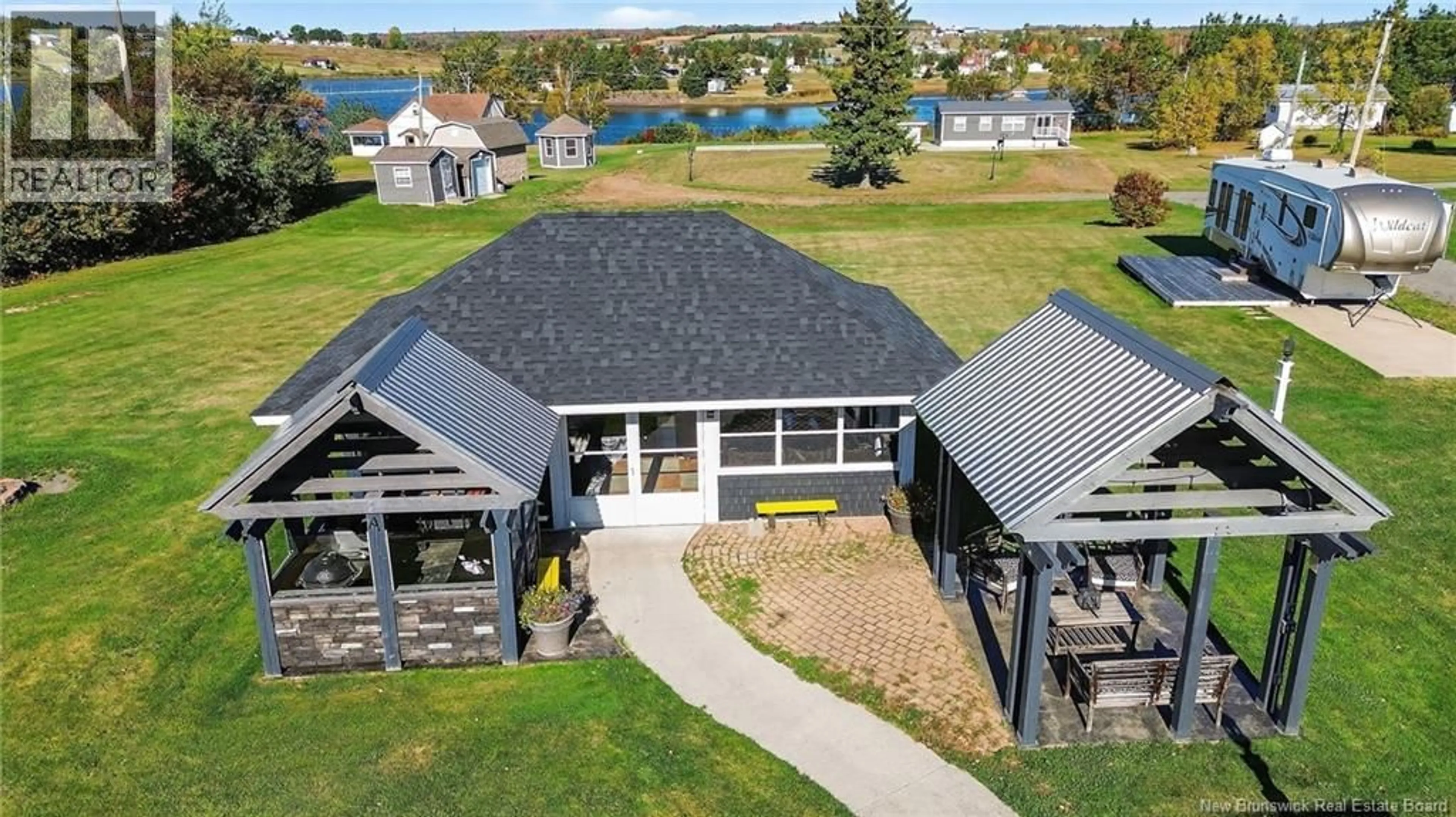 A pic from outside/outdoor area/front of a property/back of a property/a pic from drone, water/lake/river/ocean view for 173 PARADIS, Sainte-Marie-De-Kent New Brunswick E4S1V2