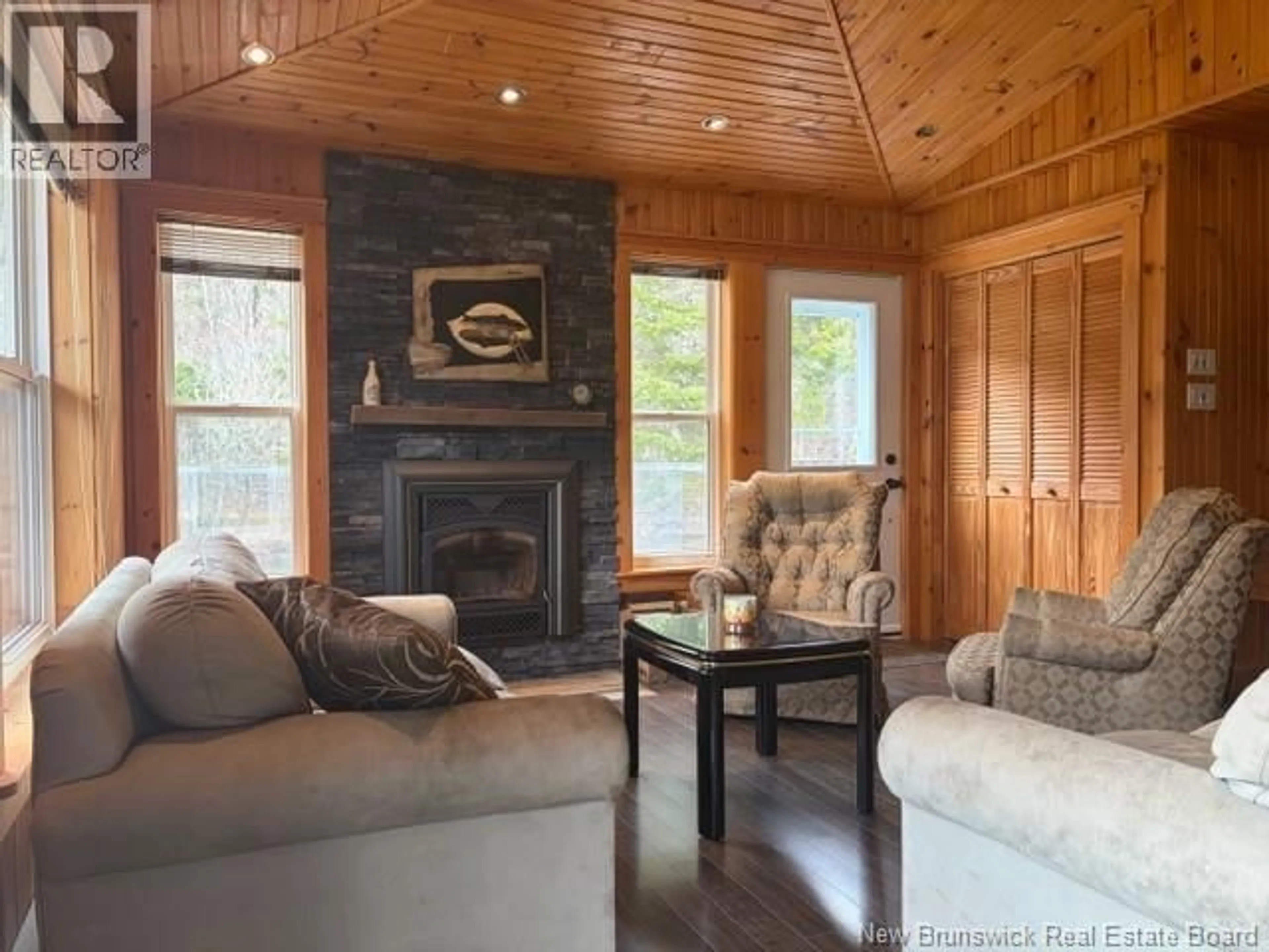 Living room with furniture, wood/laminate floor for 11592 ROUTE 114, Springdale New Brunswick E4E3Y4