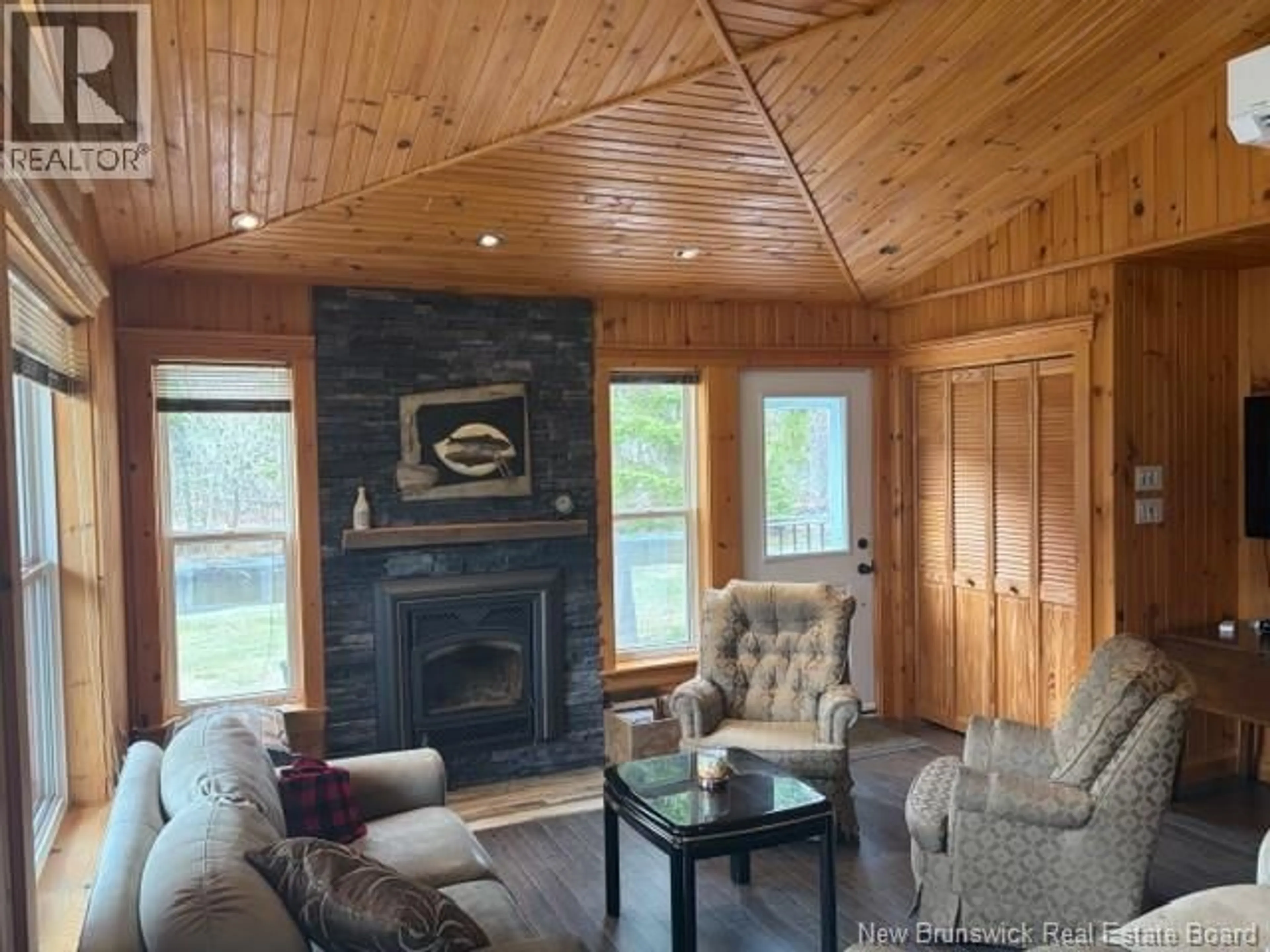 Living room with furniture, wood/laminate floor for 11592 ROUTE 114, Springdale New Brunswick E4E3Y4