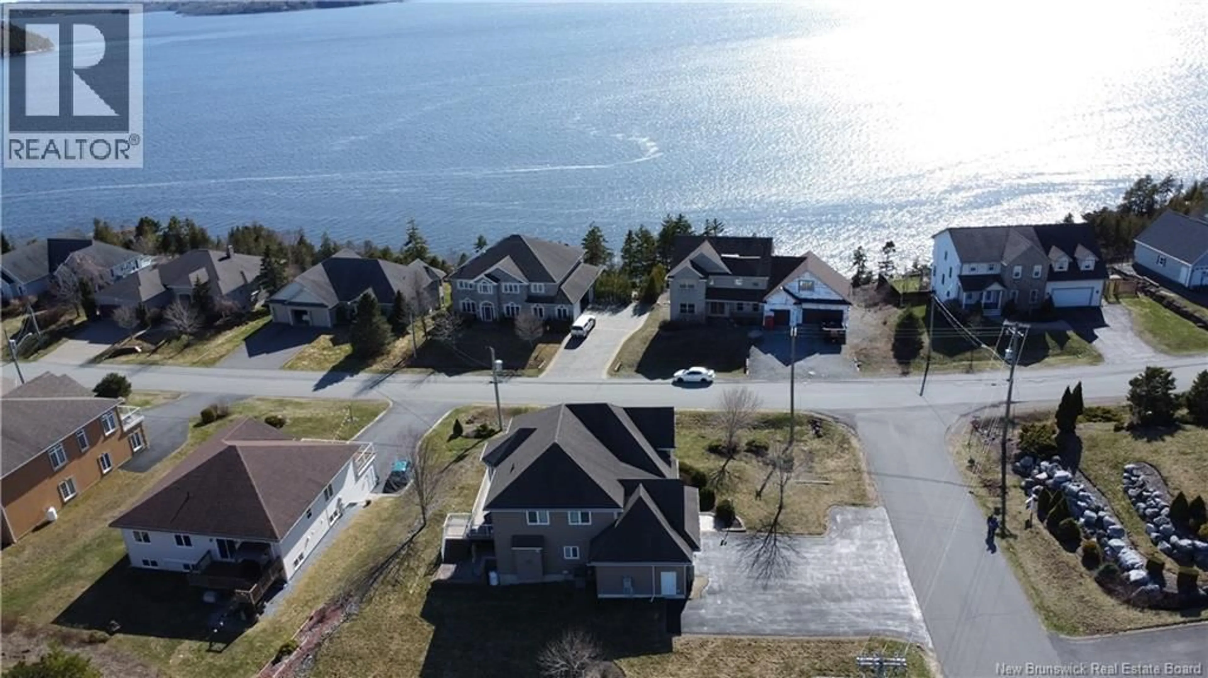 A pic from outside/outdoor area/front of a property/back of a property/a pic from drone, water/lake/river/ocean view for 4 ADMIRALTY DRIVE, Saint John New Brunswick E2K0B7