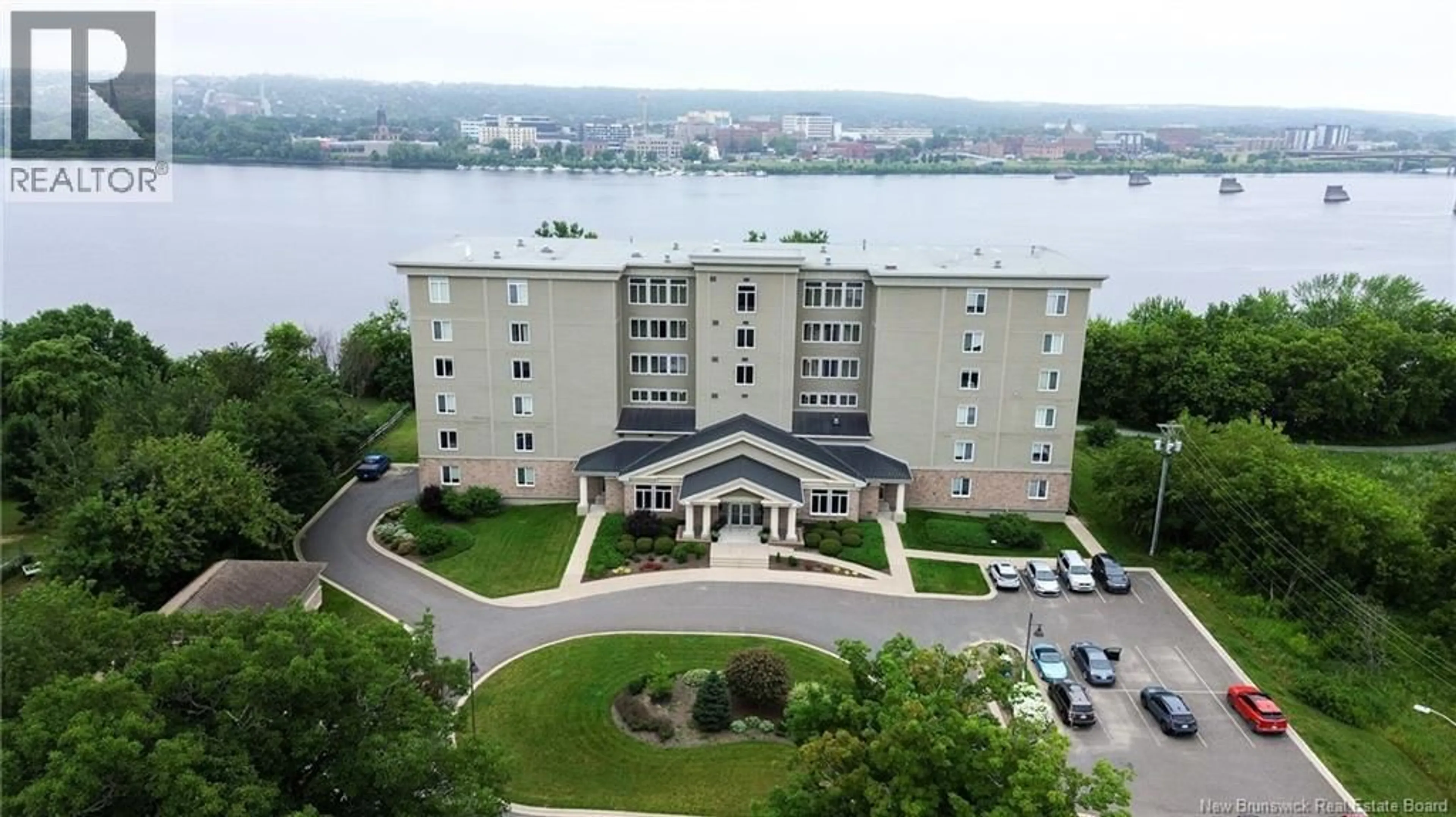 A pic from outside/outdoor area/front of a property/back of a property/a pic from drone, water/lake/river/ocean view for 505 - 1 SOUTHVIEW LANE LANE, Fredericton New Brunswick E3A5V3