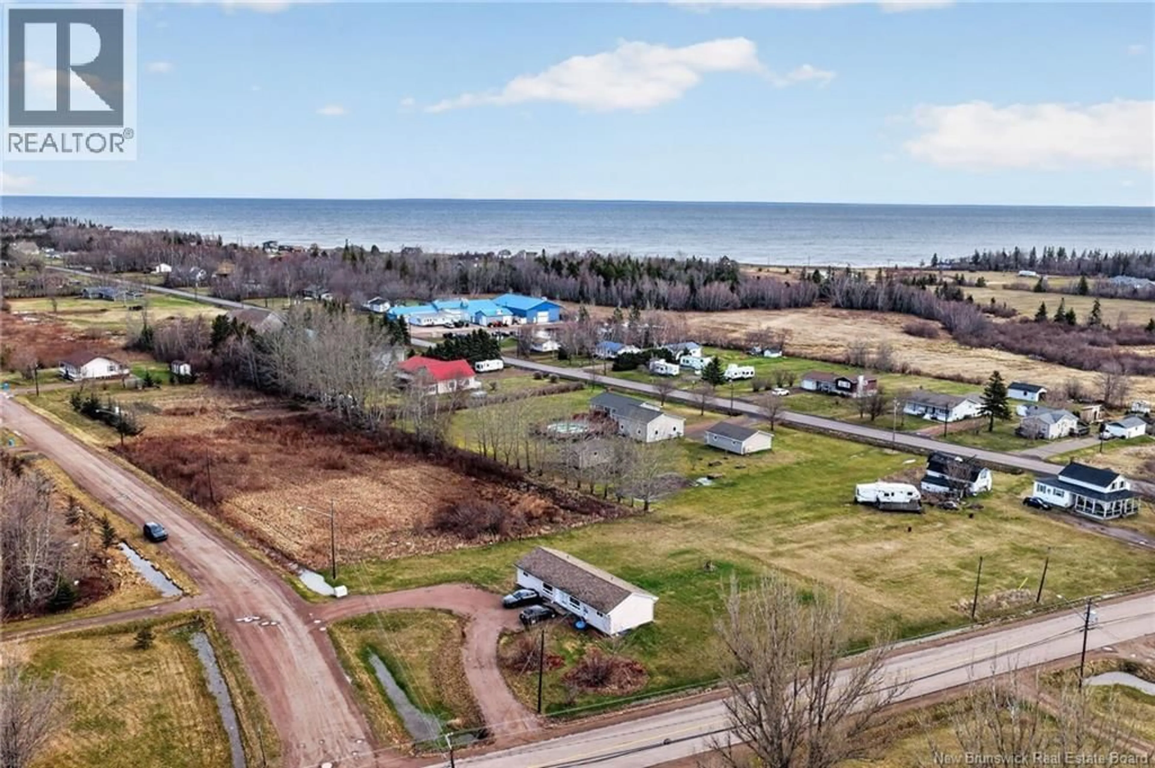 A pic from outside/outdoor area/front of a property/back of a property/a pic from drone, water/lake/river/ocean view for 1-3 ALCIDE STREET, Trois Ruisseaux New Brunswick E4N2S9