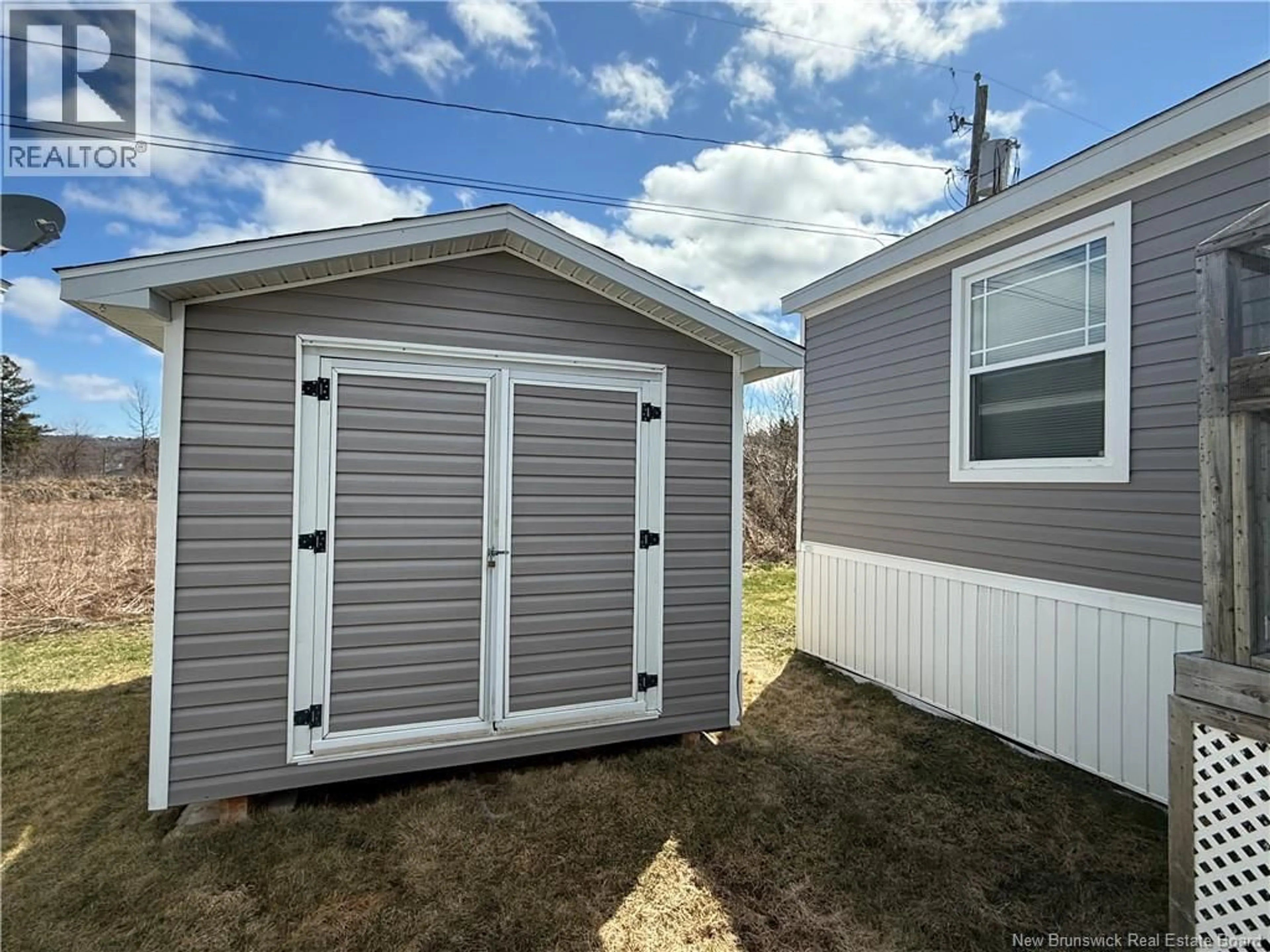 Home with vinyl exterior material, street for 11 IVORY COURT, Woodstock New Brunswick E7M0G5
