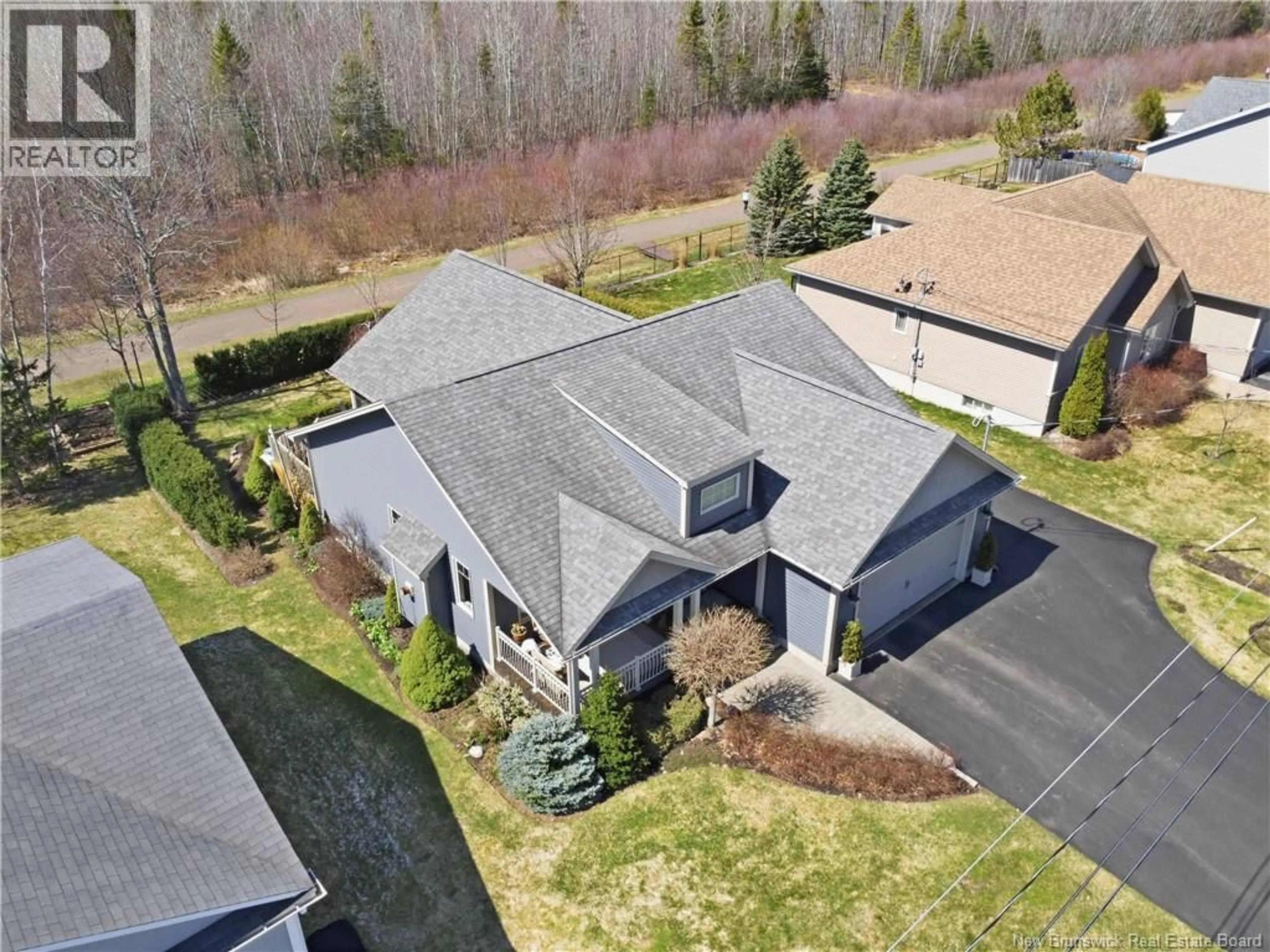 A pic from outside/outdoor area/front of a property/back of a property/a pic from drone, street for 20 FOREST GROVE ROAD, Moncton New Brunswick E1G5K5