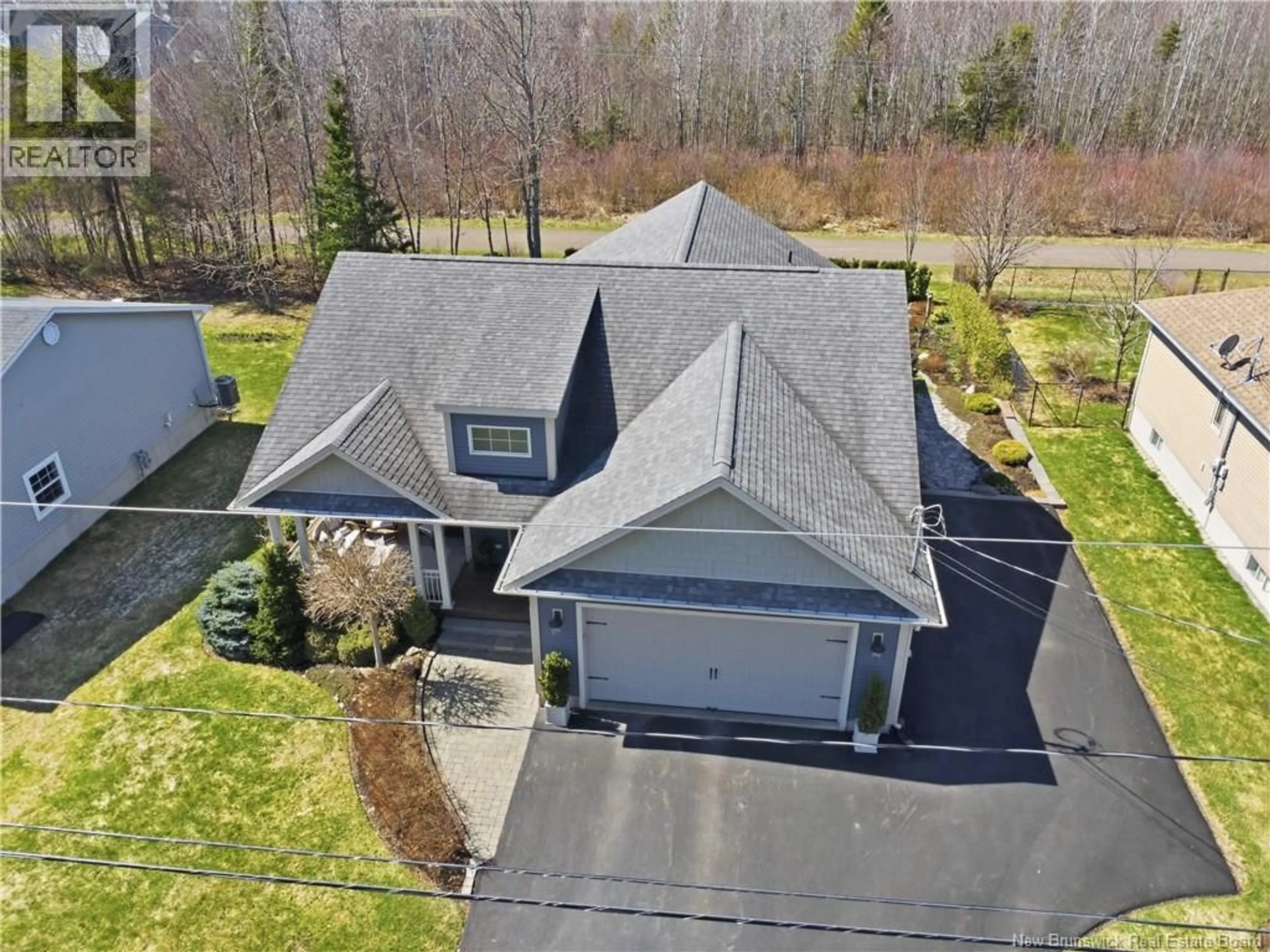 A pic from outside/outdoor area/front of a property/back of a property/a pic from drone, street for 20 FOREST GROVE ROAD, Moncton New Brunswick E1G5K5
