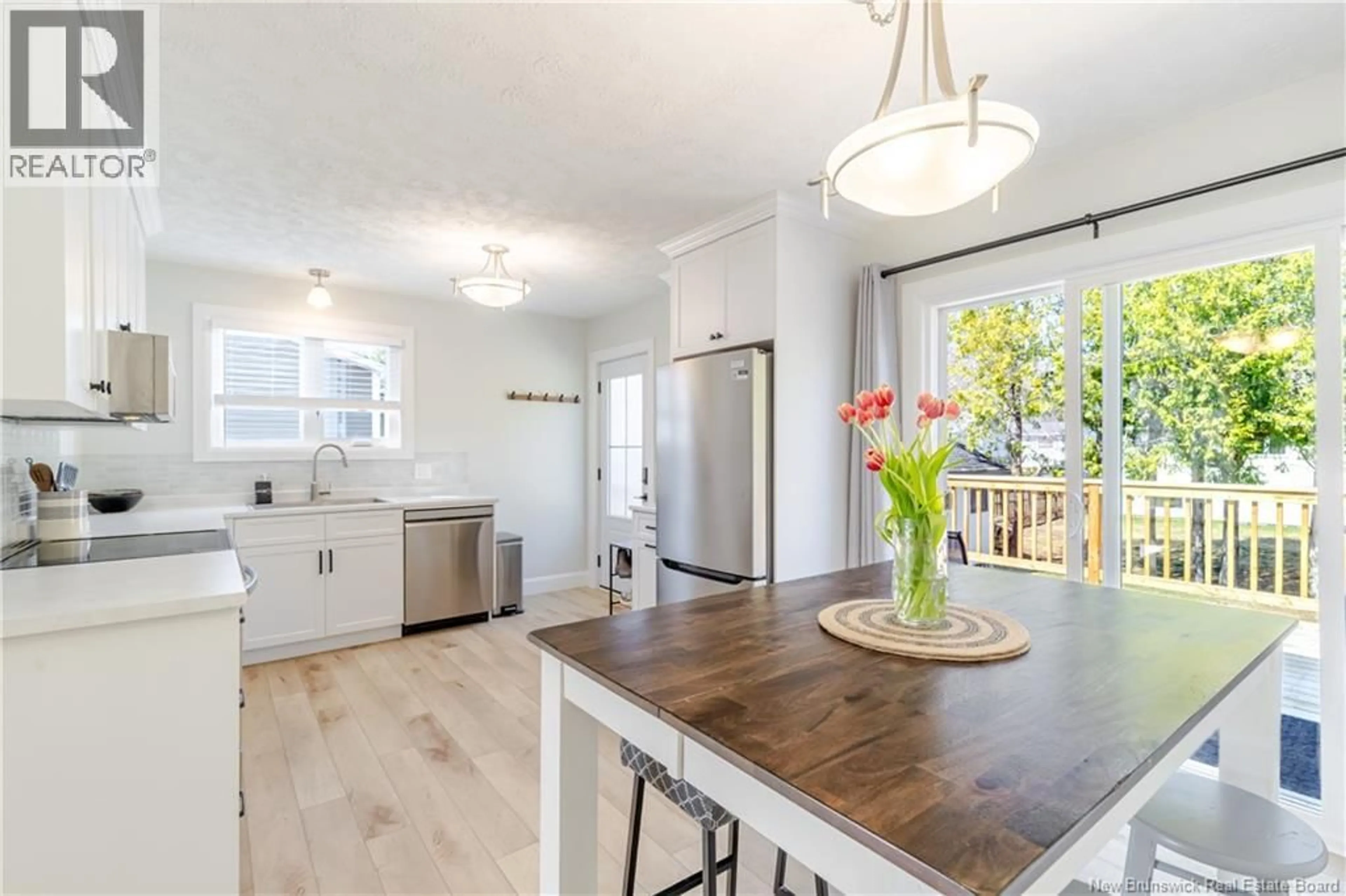 Open concept kitchen, wood/laminate floor for 12 LAPOINTE STREET, Fredericton New Brunswick E3A4Y5