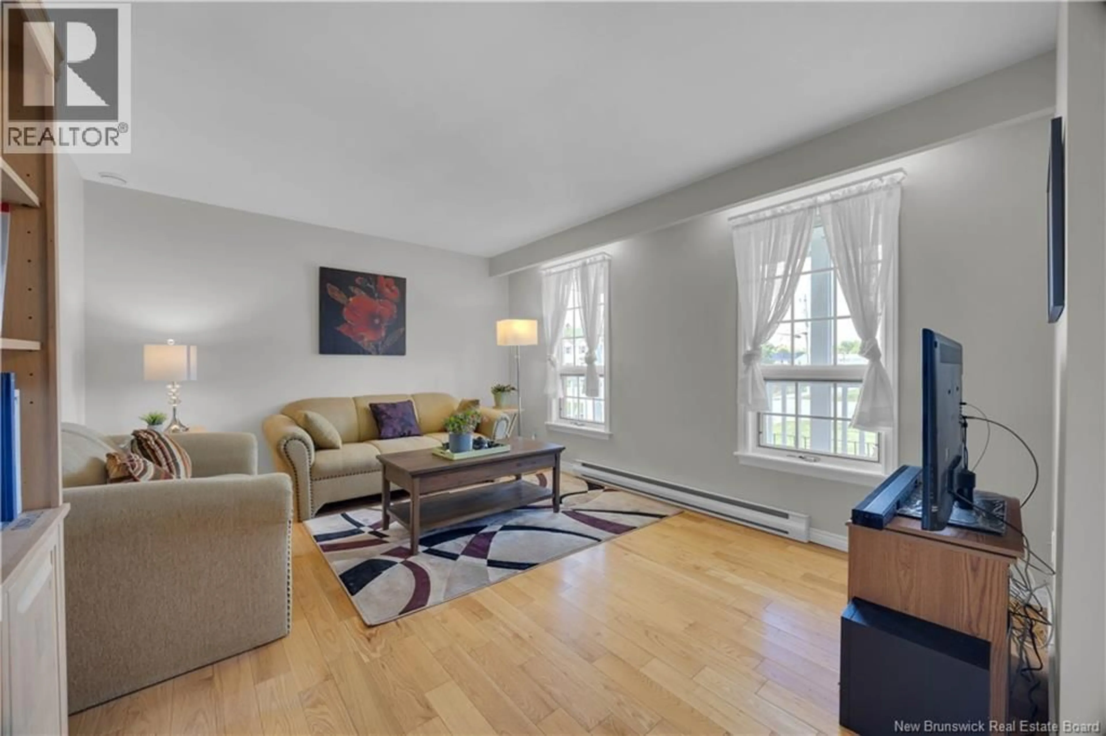 Living room with furniture, wood/laminate floor for 315 BOARS HEAD ROAD, Saint John New Brunswick E2K5B9