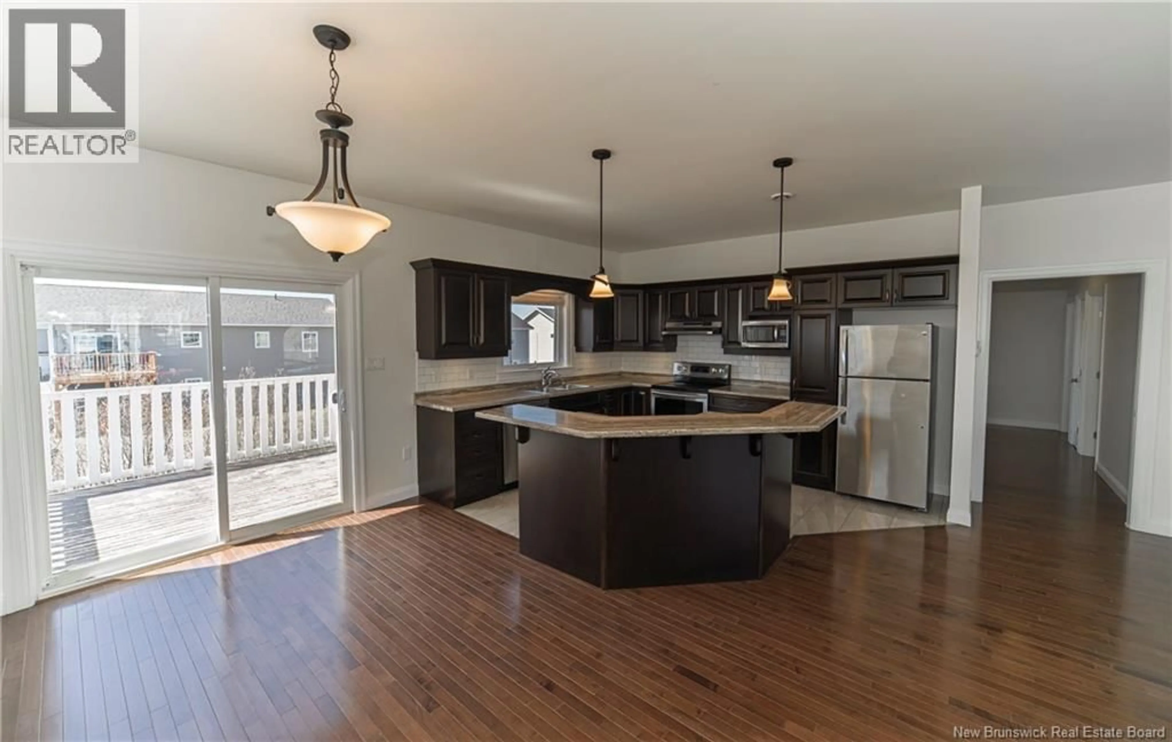 Open concept kitchen, wood/laminate floor for 6 BURNETT STREET, Oromocto New Brunswick E2V0J4