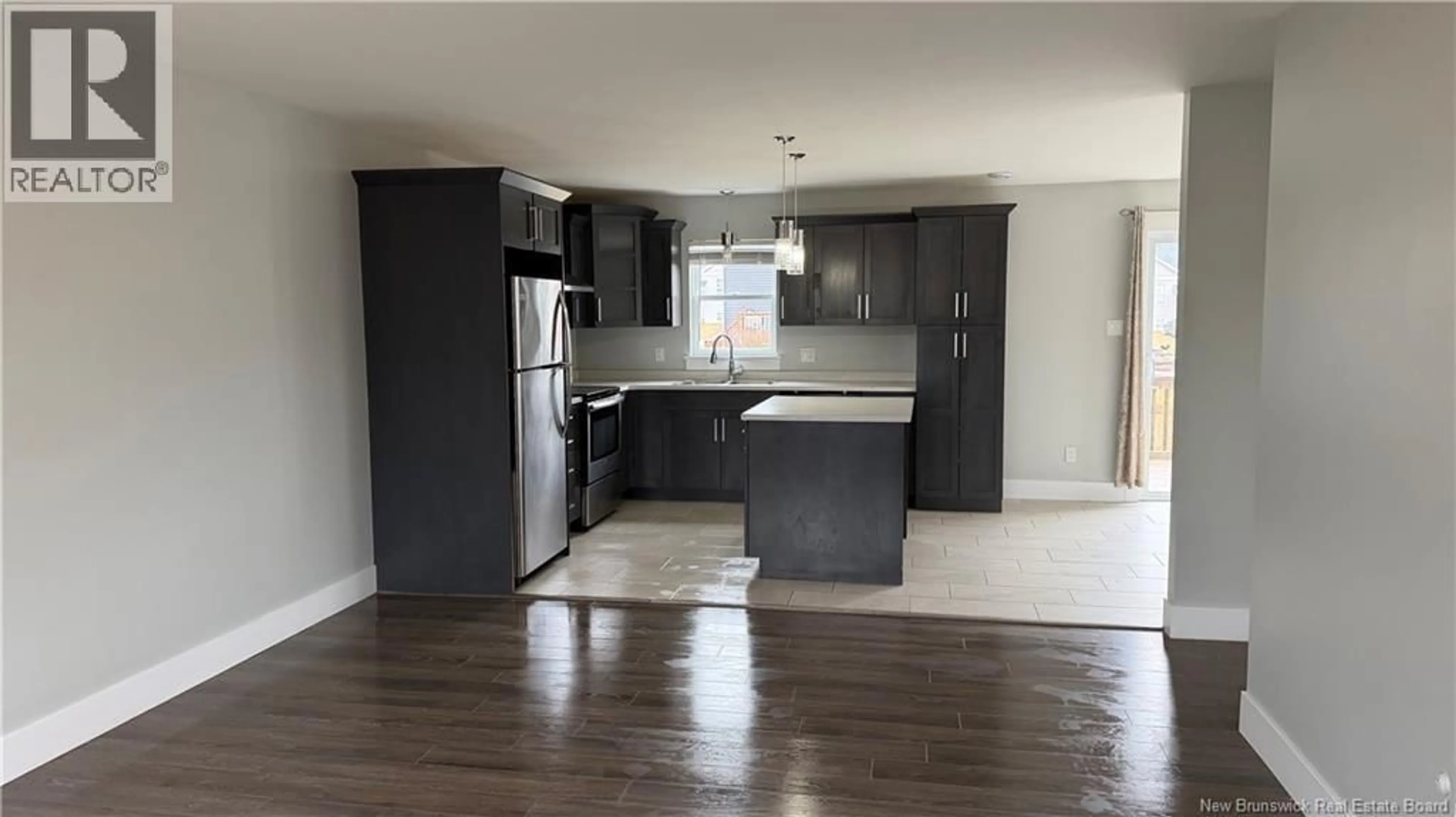 Open concept kitchen, wood/laminate floor for 57 DES PEUPLIERS, Dieppe New Brunswick E1A9E4
