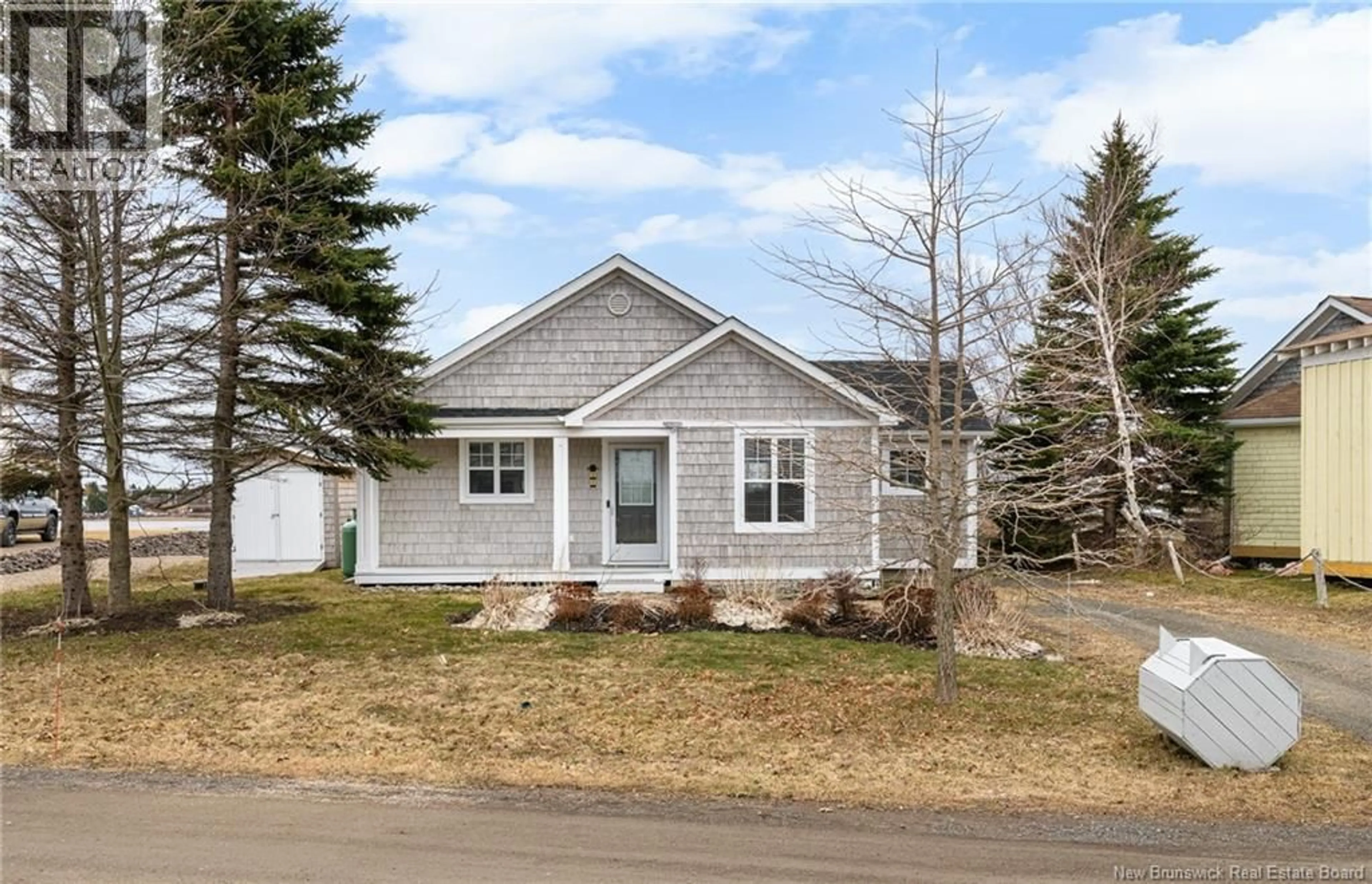 Home with vinyl exterior material, street for 54 ACADIE STREET, Cocagne New Brunswick E4R5Y6