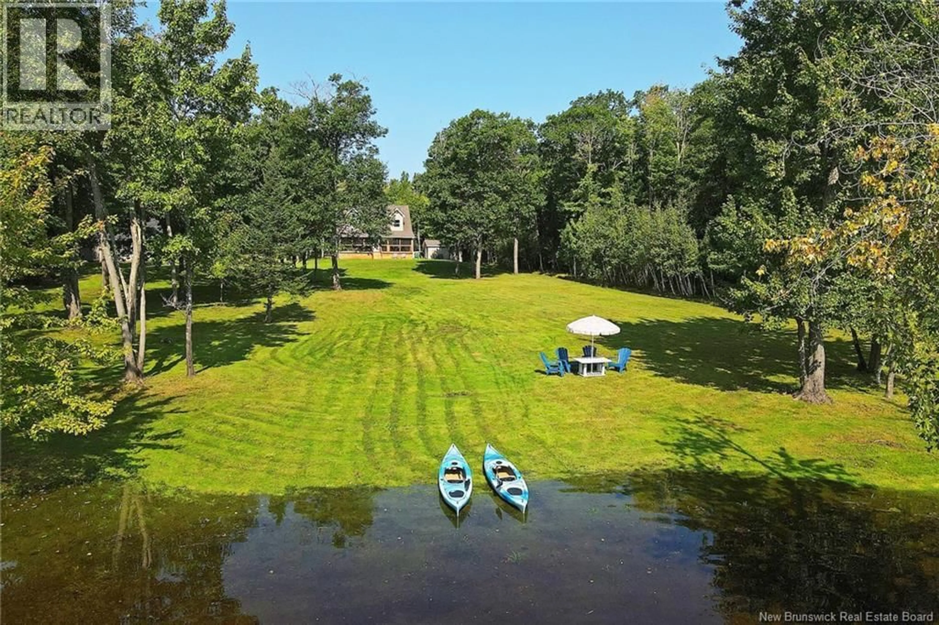 A pic from outside/outdoor area/front of a property/back of a property/a pic from drone, water/lake/river/ocean view for 1276 COX POINT ROAD, Cumberland Bay New Brunswick E4A2Z3