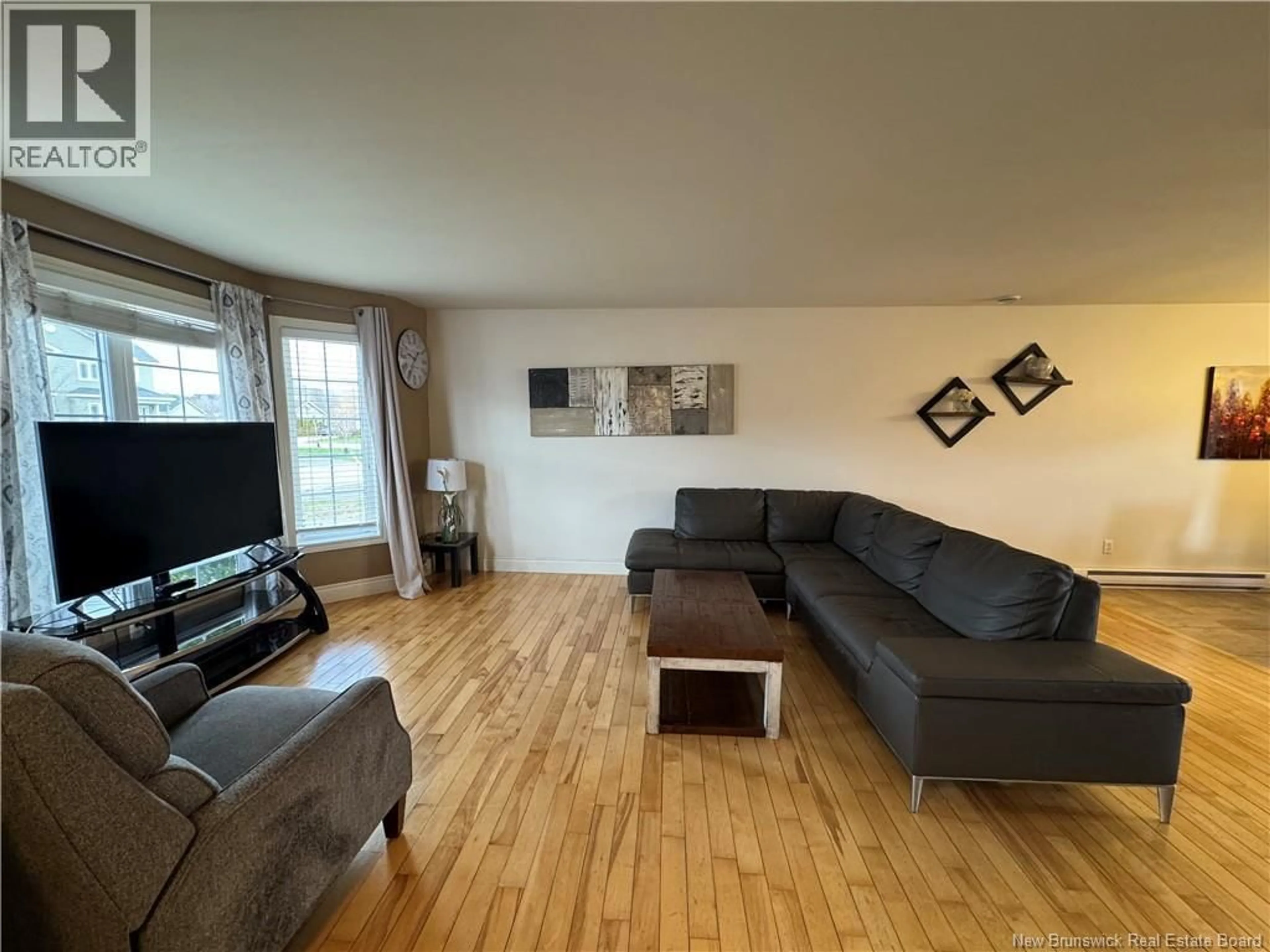Living room with furniture, wood/laminate floor for 117 JEANNETTE STREET, Dieppe New Brunswick E1A0K3