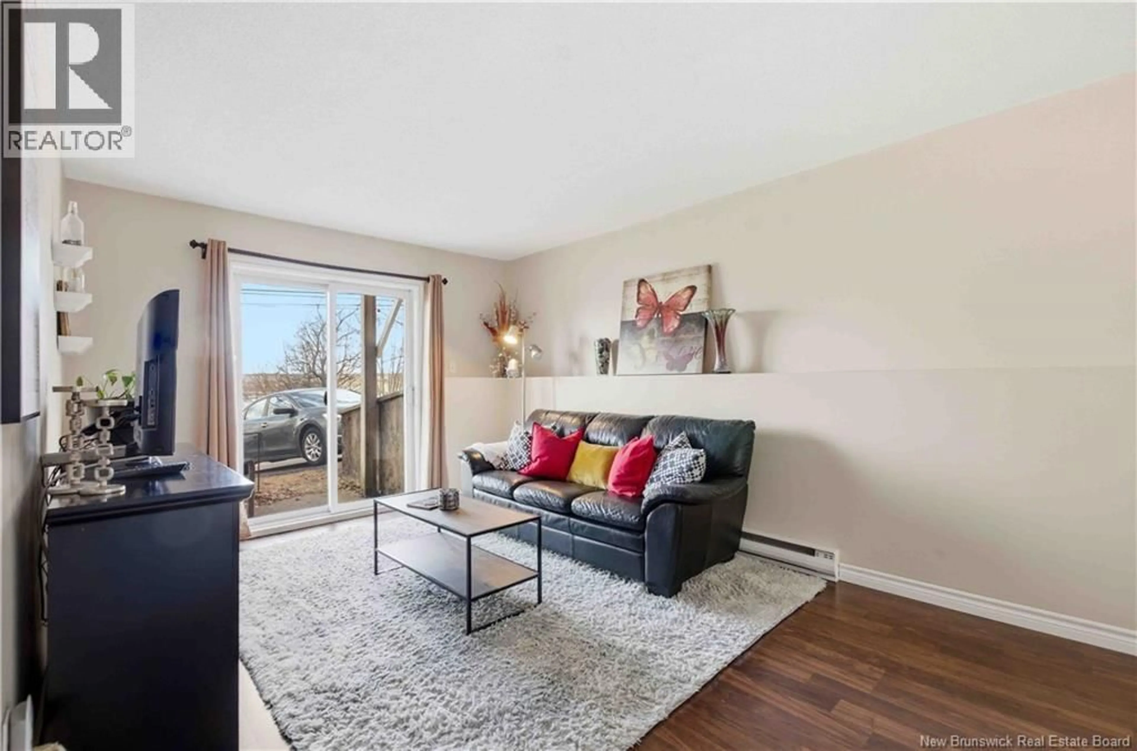 Living room with furniture, wood/laminate floor for 2 - 228 DUNNS CROSSING STREET, Fredericton New Brunswick E3B2A6