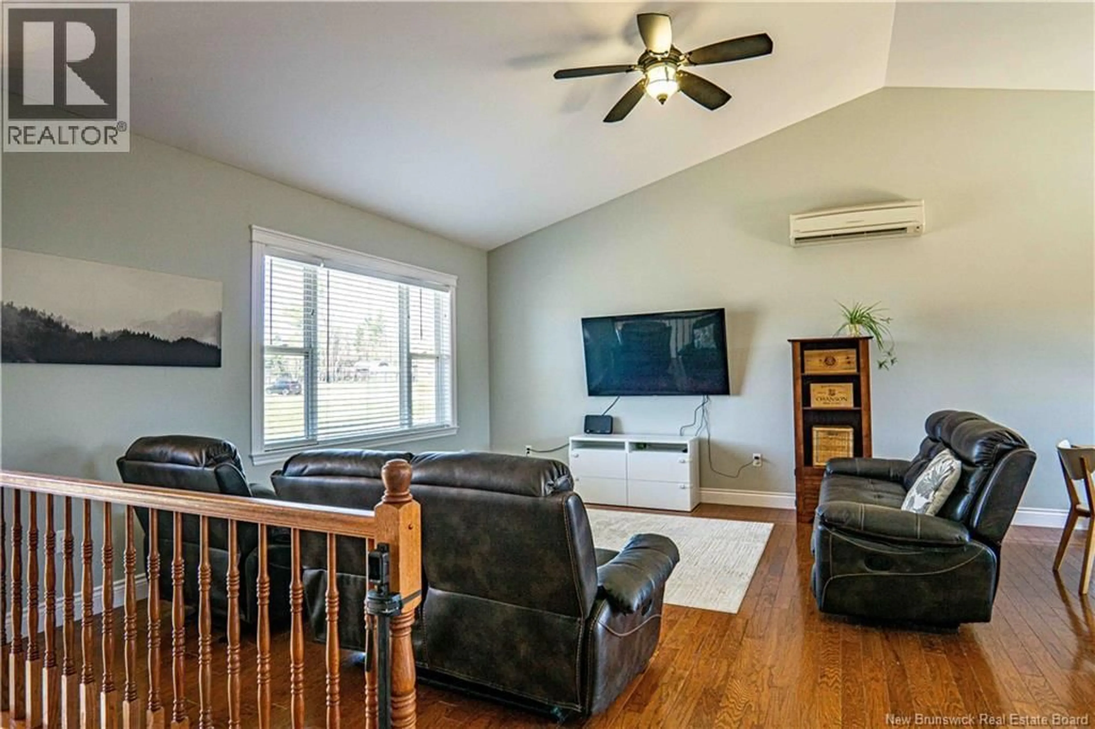 Living room with furniture, wood/laminate floor for 4 MCCONNELL STREET, Oromocto West New Brunswick E2V0J1