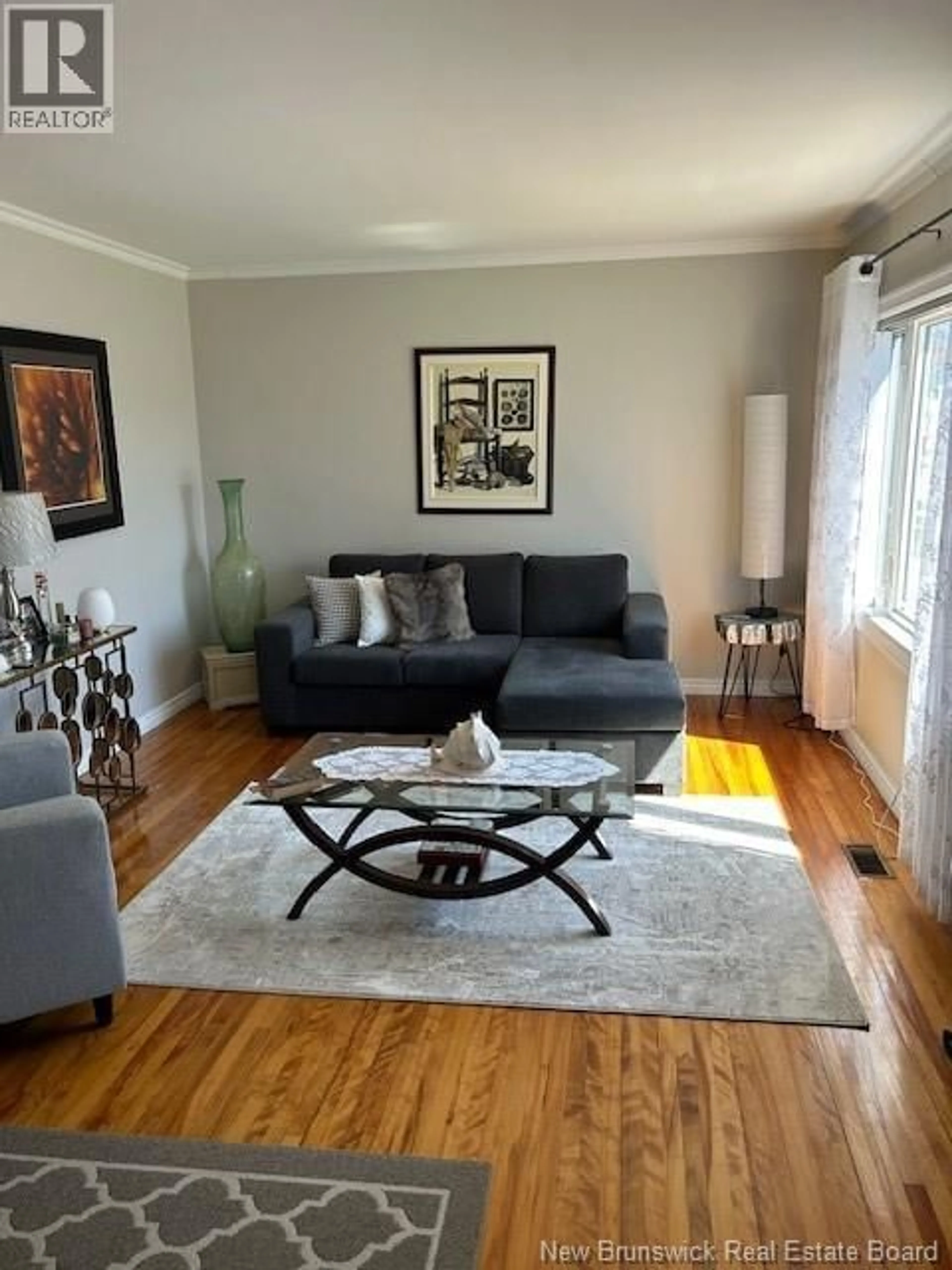Living room with furniture, wood/laminate floor for 49 MANSFIELD STREET, Moncton New Brunswick E1A2V8