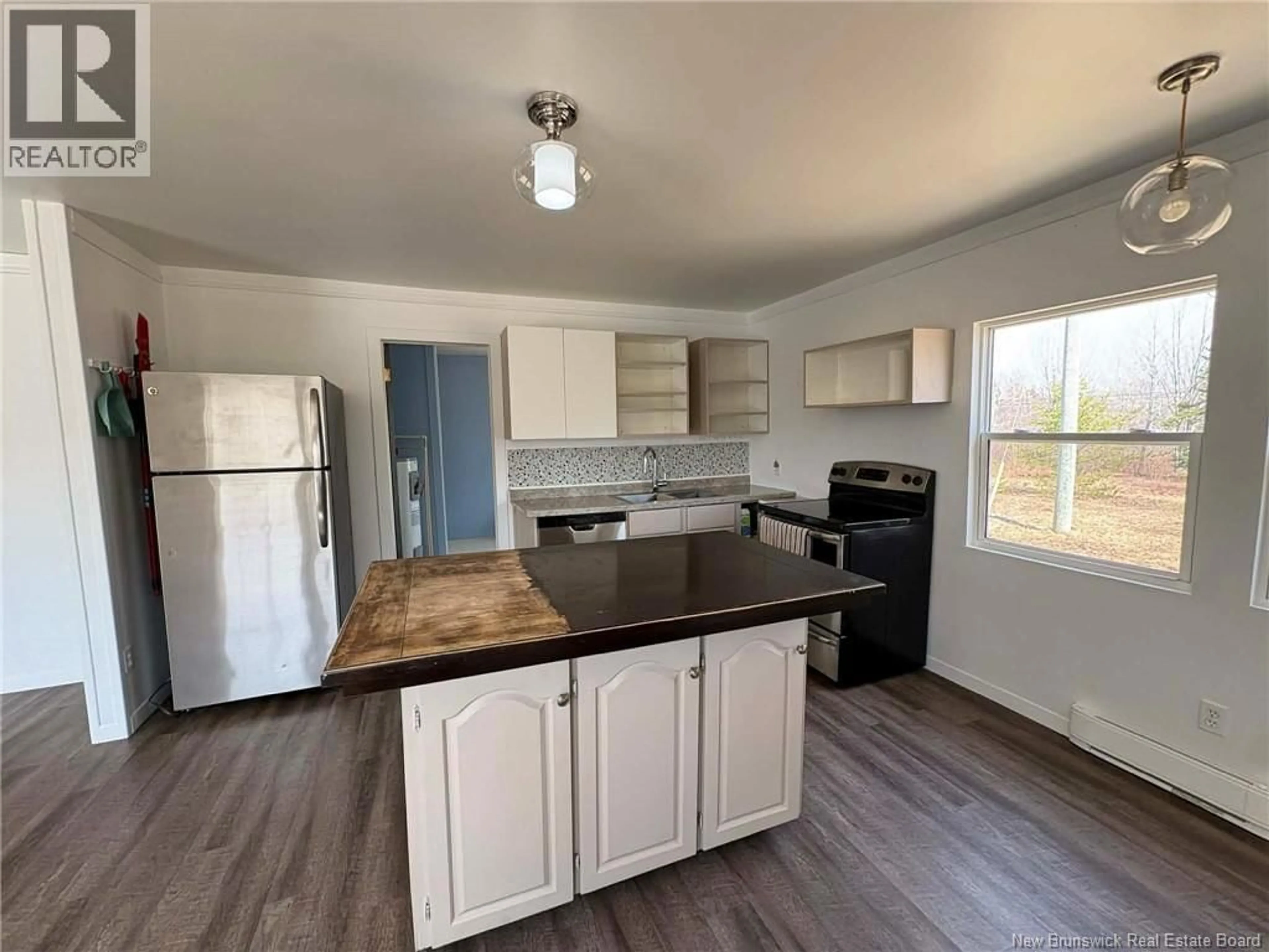 Open concept kitchen, wood/laminate floor for 1873 ROUTE 530 ROUTE, Grande-Digue New Brunswick E4R5E7