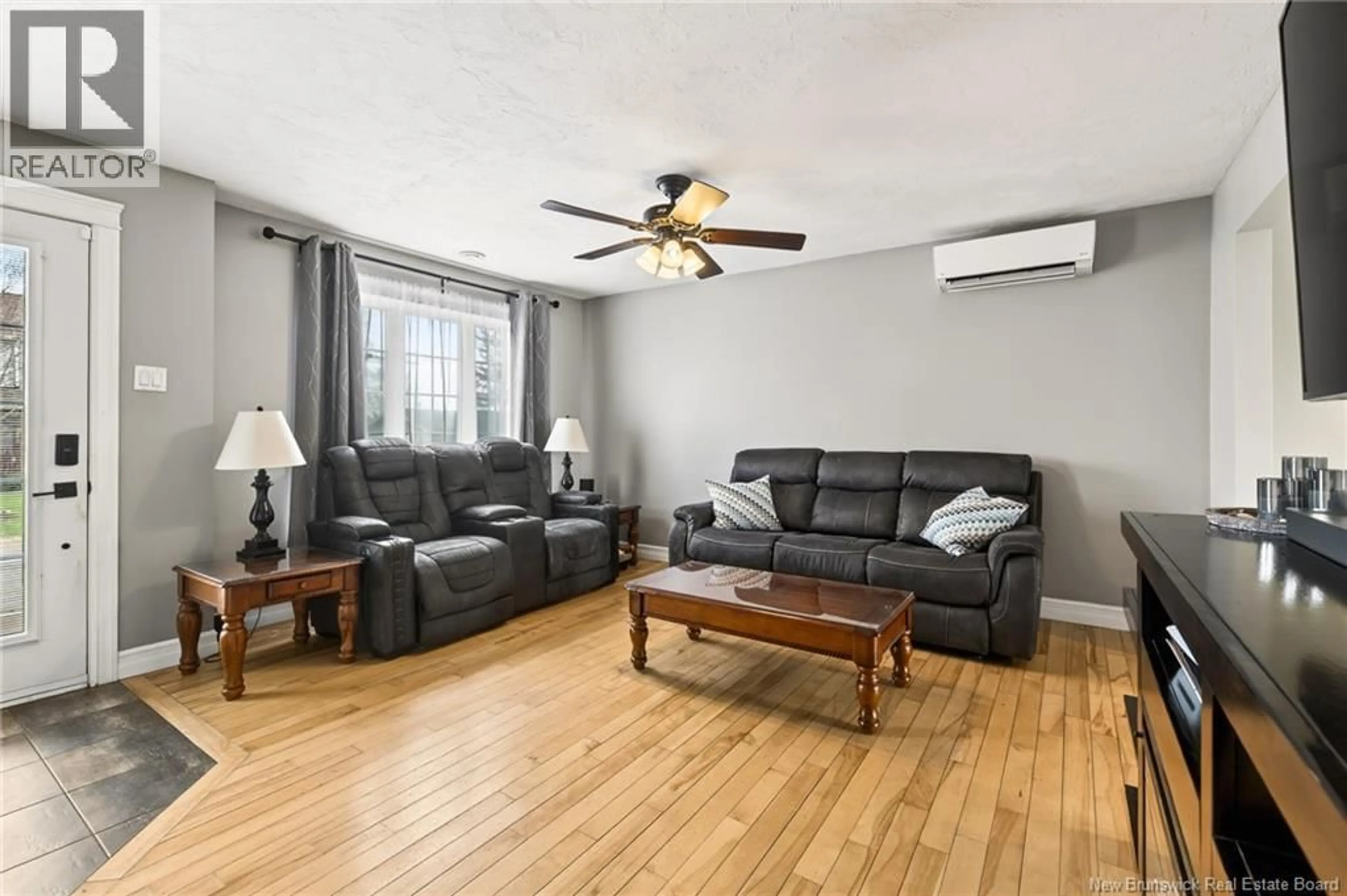 Living room with furniture, wood/laminate floor for 179 JORDAN CRESCENT, Moncton New Brunswick E1C0S5