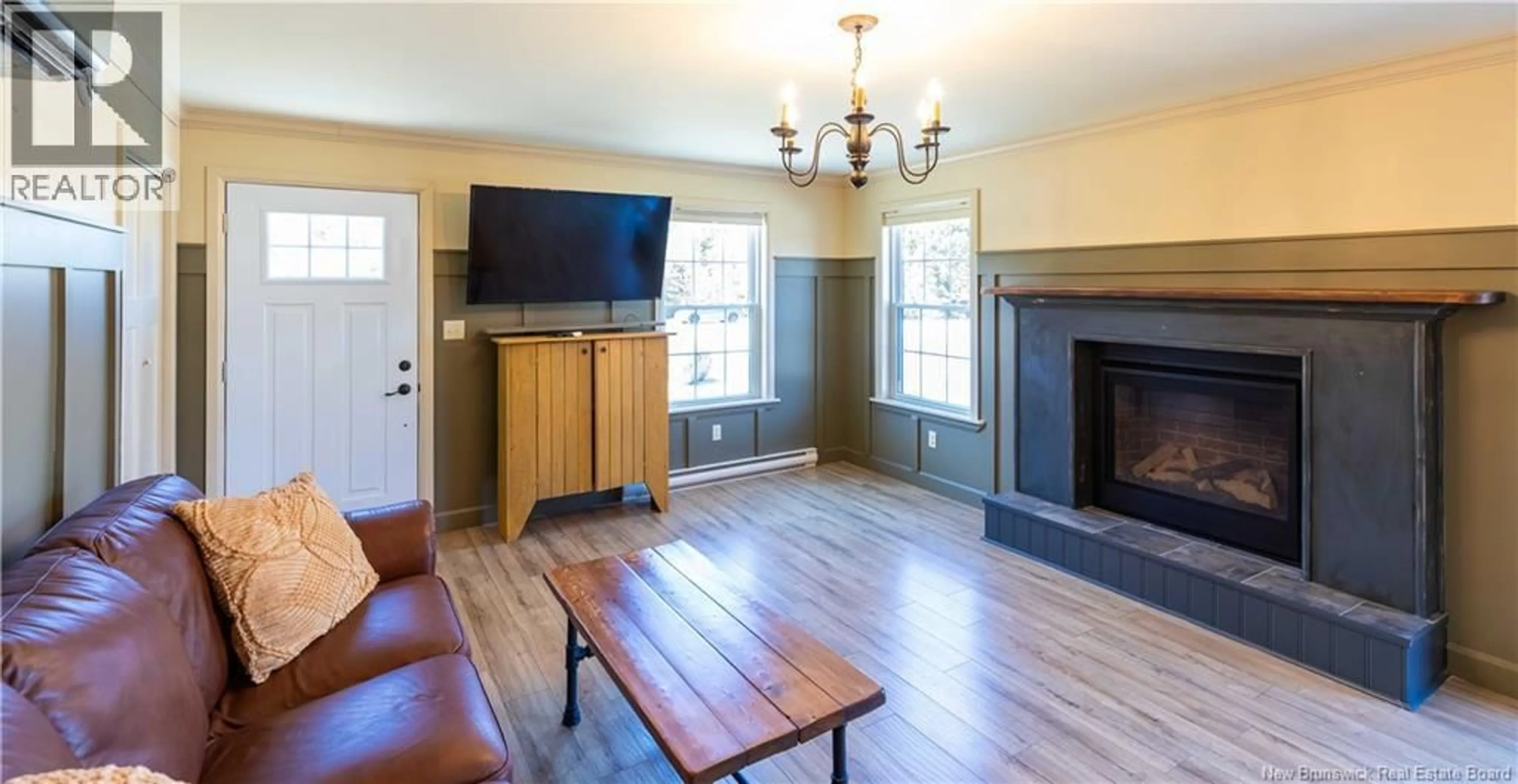 Living room with furniture, wood/laminate floor for 24 MCLELLAN DRIVE, Willow Grove New Brunswick E2S1G1