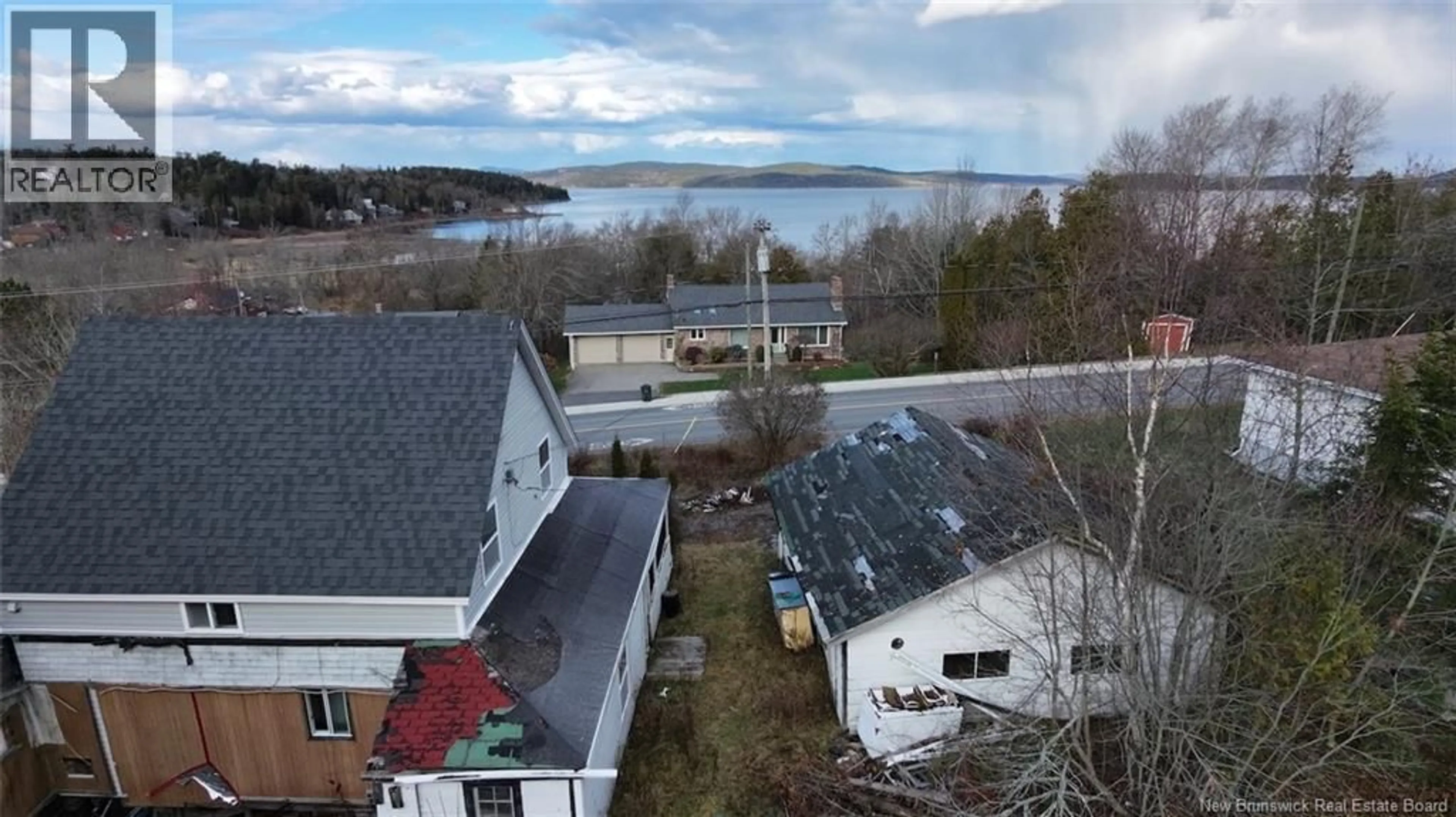 A pic from outside/outdoor area/front of a property/back of a property/a pic from drone, water/lake/river/ocean view for 2879 WESTFIELD ROAD, Saint John New Brunswick E2M6S6