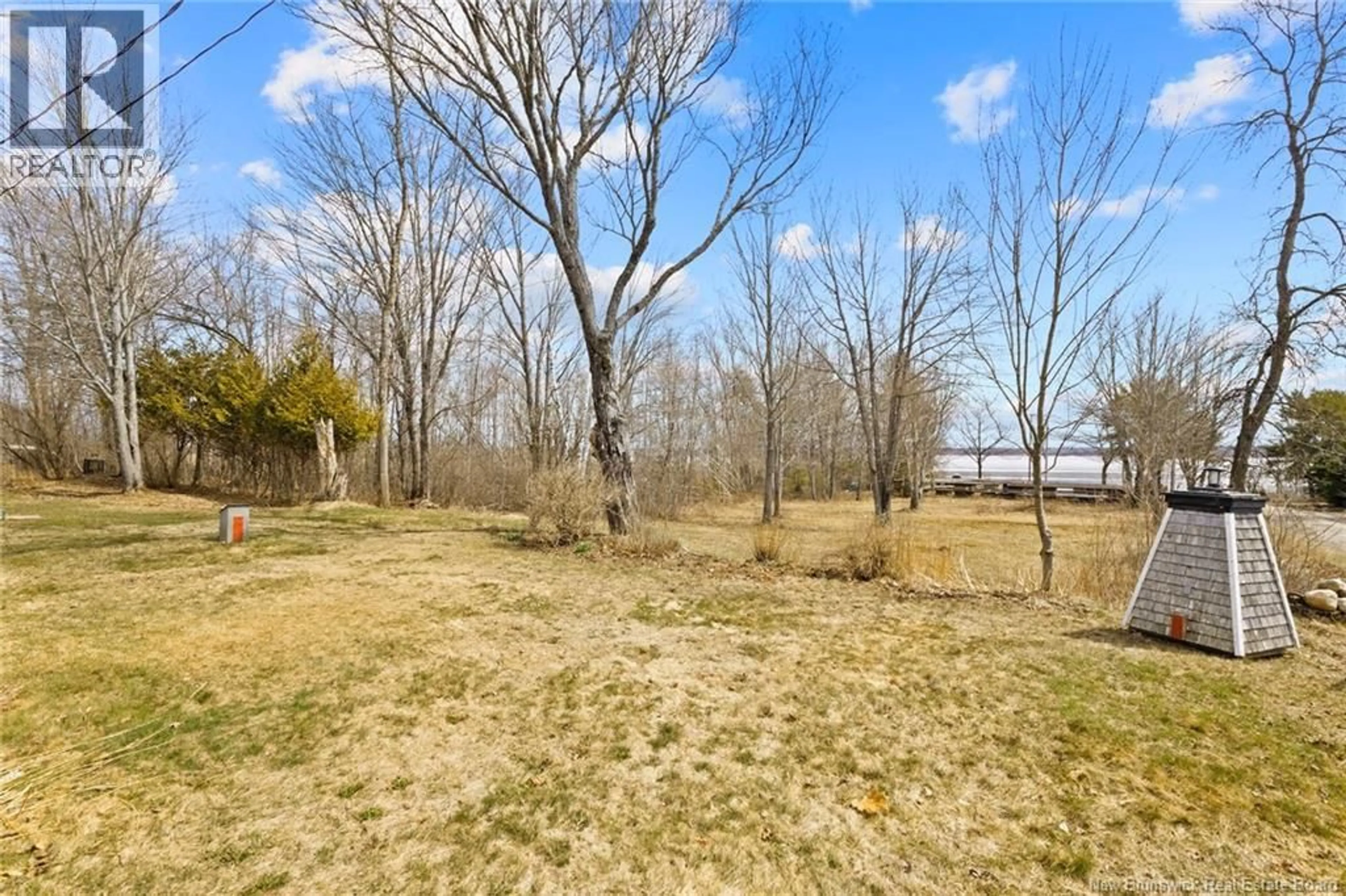 A pic from outside/outdoor area/front of a property/back of a property/a pic from drone, water/lake/river/ocean view for 11 WHARF ROAD, Newcastle Creek New Brunswick E4R2J8