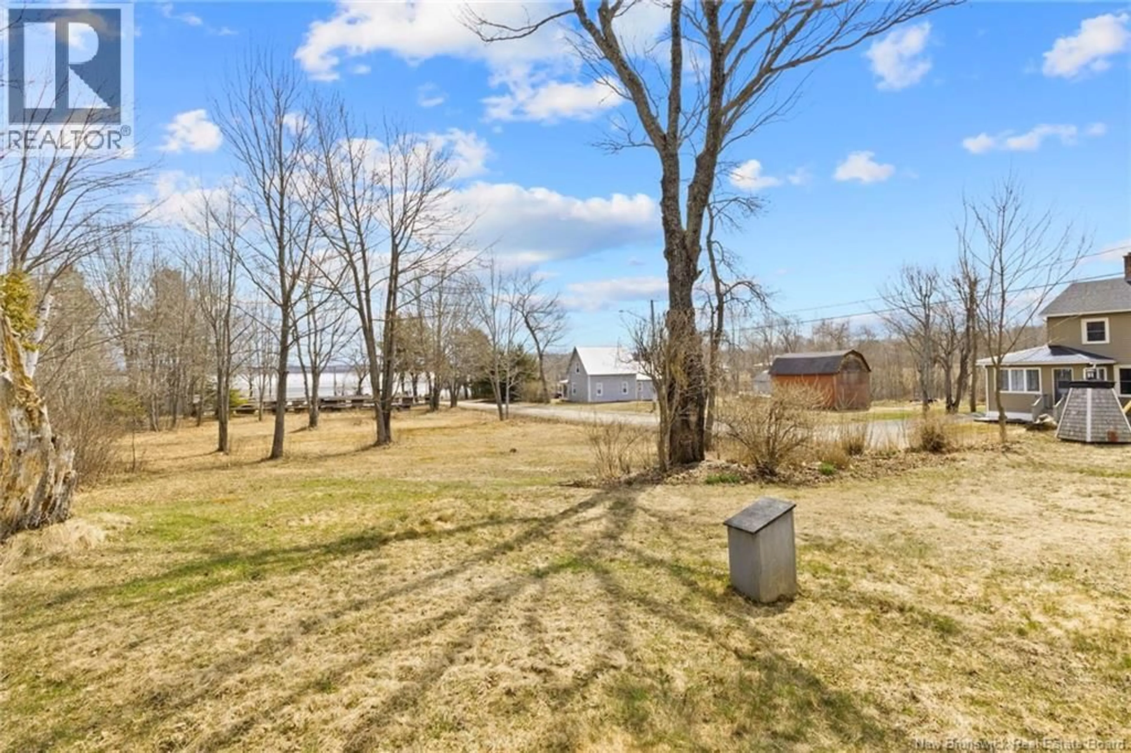 A pic from outside/outdoor area/front of a property/back of a property/a pic from drone, water/lake/river/ocean view for 11 WHARF ROAD, Newcastle Creek New Brunswick E4R2J8