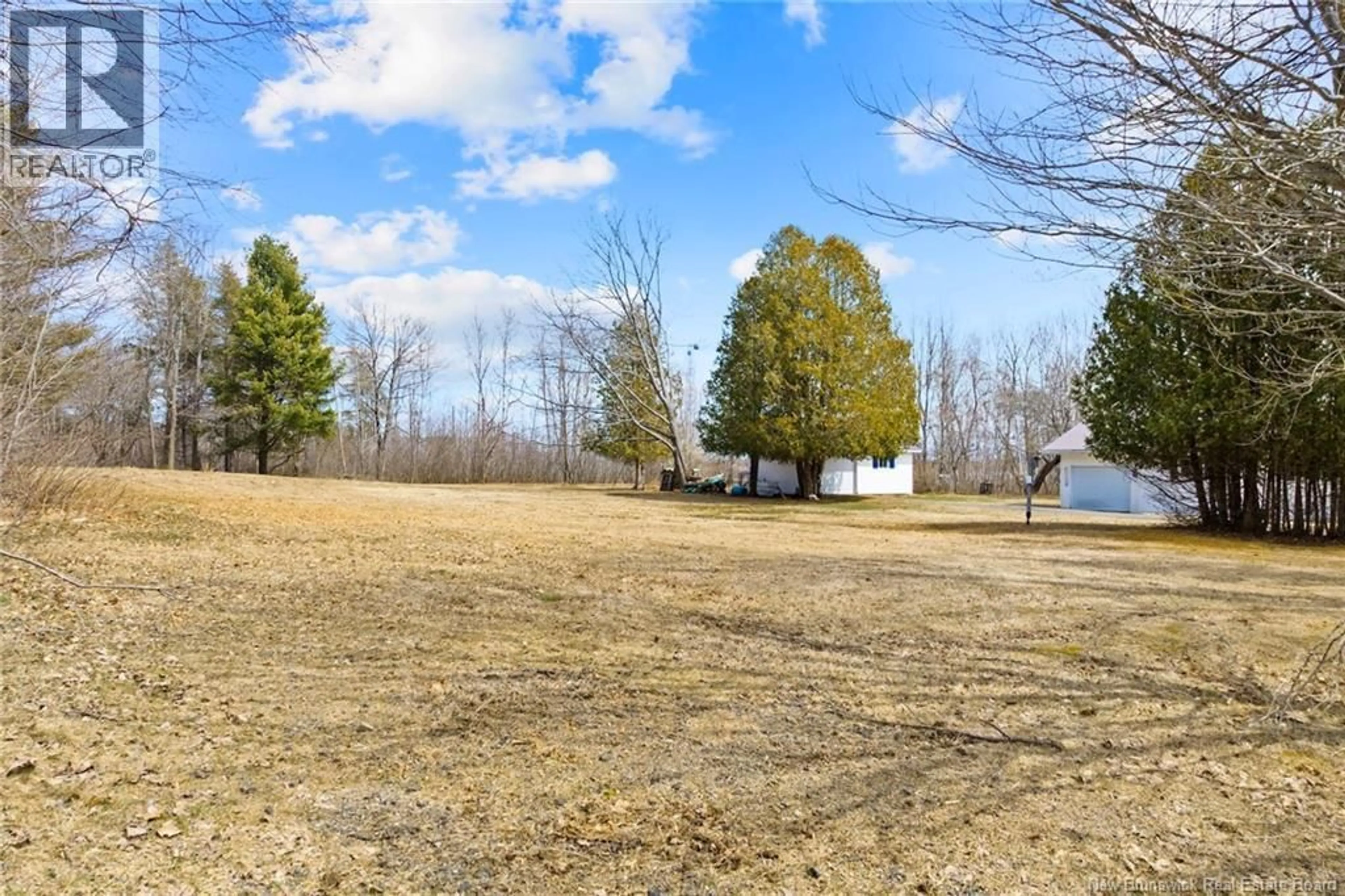 A pic from outside/outdoor area/front of a property/back of a property/a pic from drone, forest/trees view for 11 WHARF ROAD, Newcastle Creek New Brunswick E4R2J8