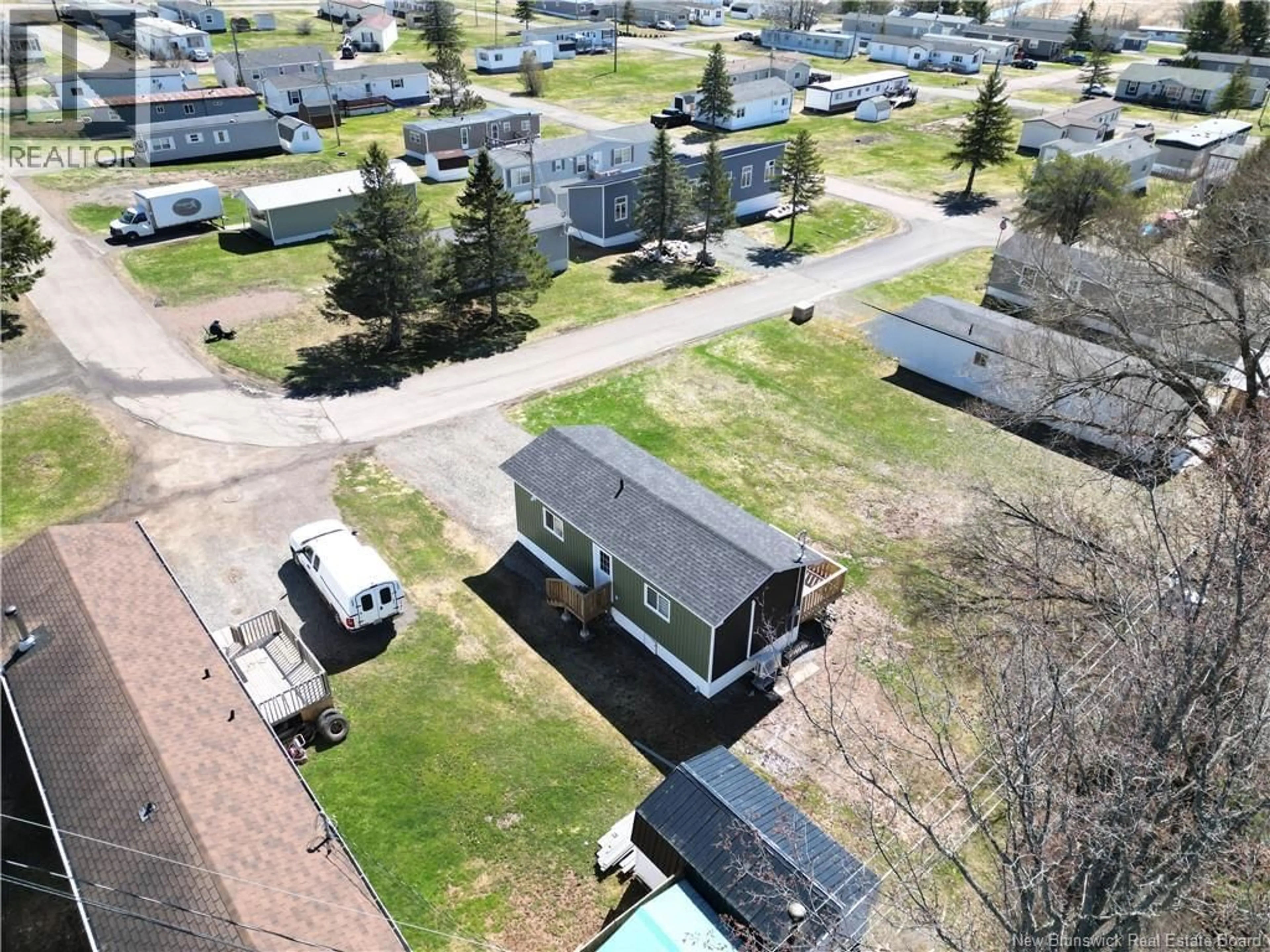 A pic from outside/outdoor area/front of a property/back of a property/a pic from drone, street for 32 CAROLYN CRESCENT, Moncton New Brunswick E1E3T6